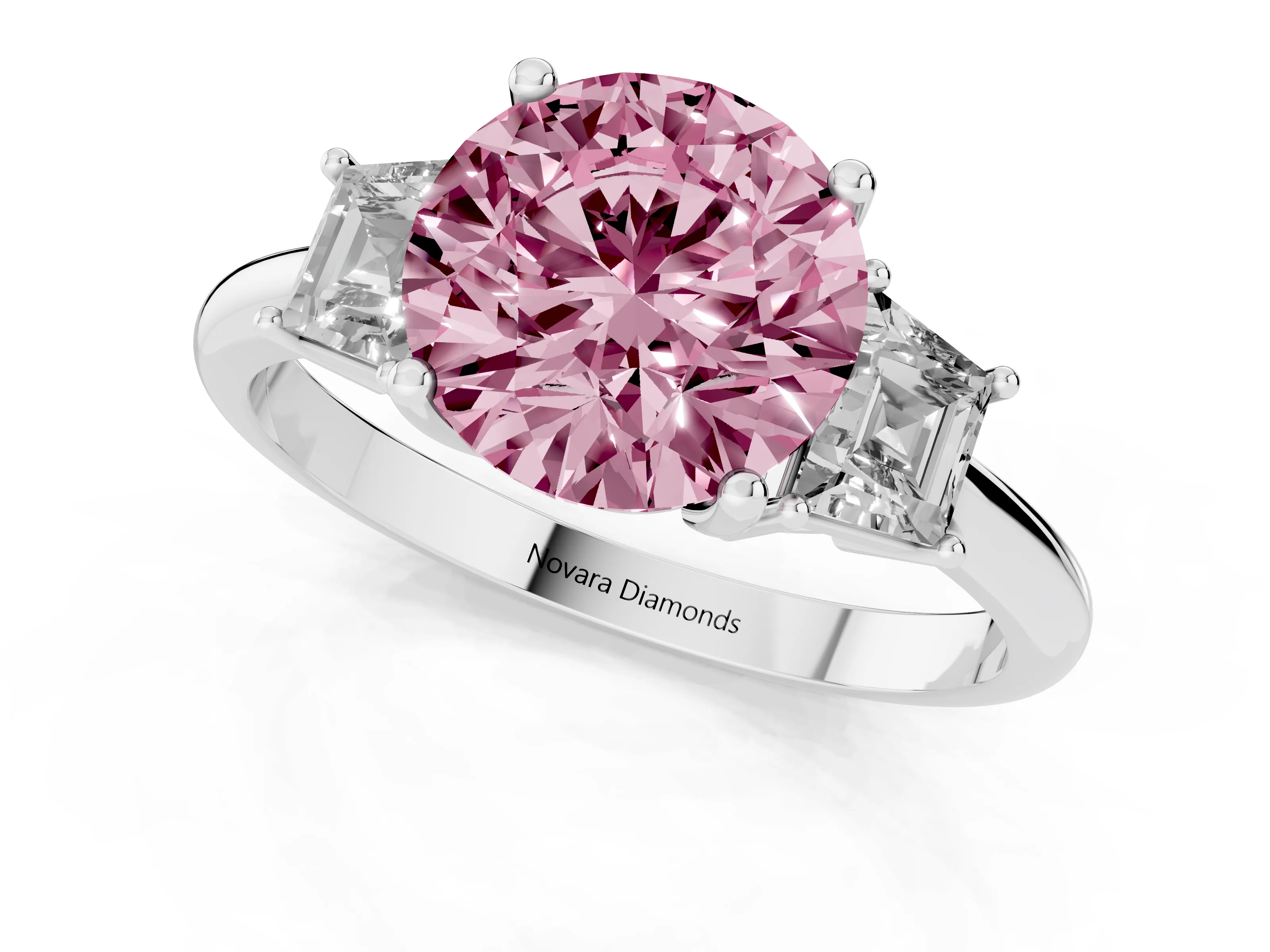 Fancy Pink Round Cut Diamond Three-Stone Ring Set in Platinum with Trapezoid Side Stones and Prong Setting