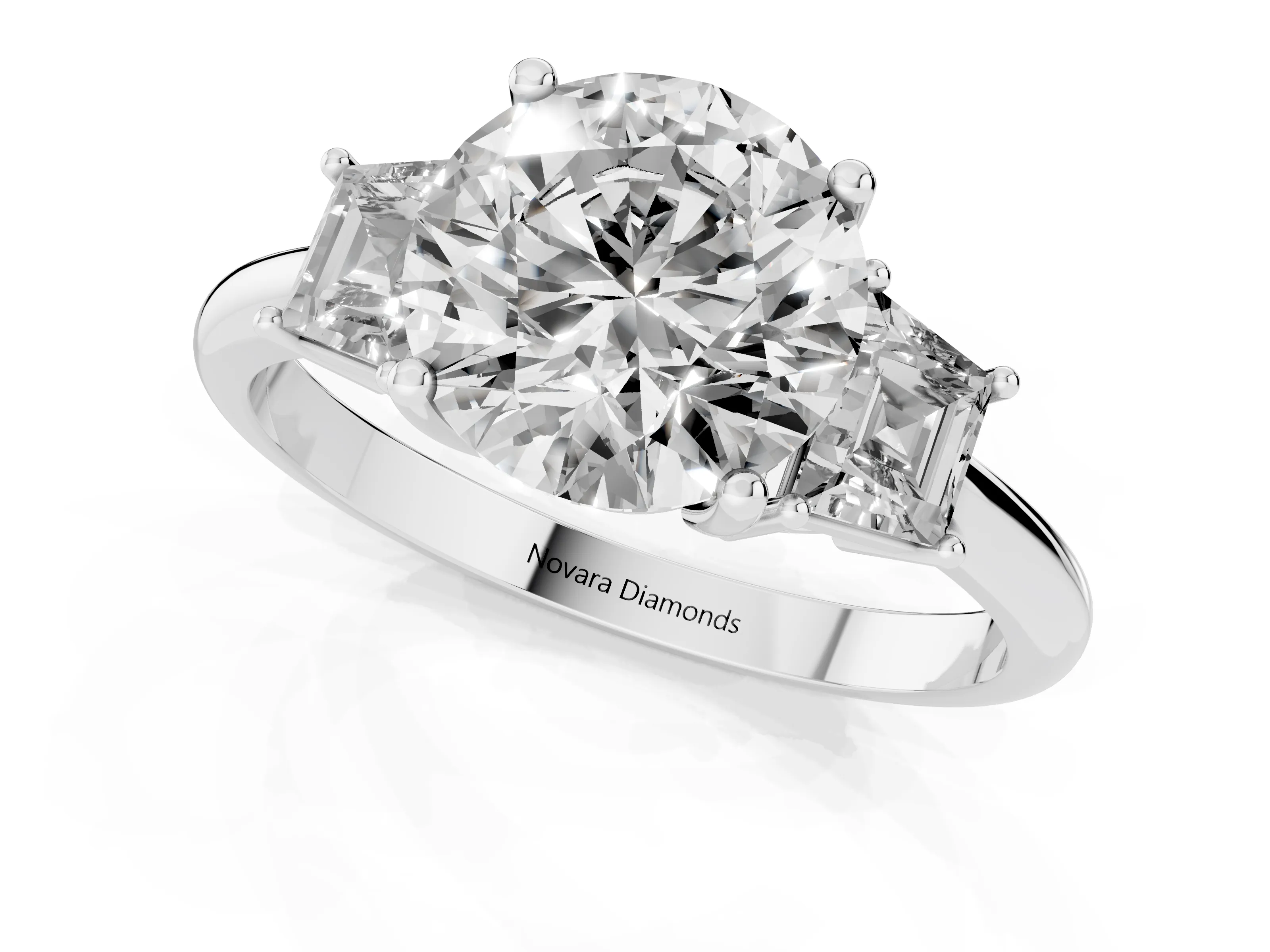 Round Cut Diamond Three-Stone Ring Set in White gold with Trapezoid Side Stones and Prong Setting
