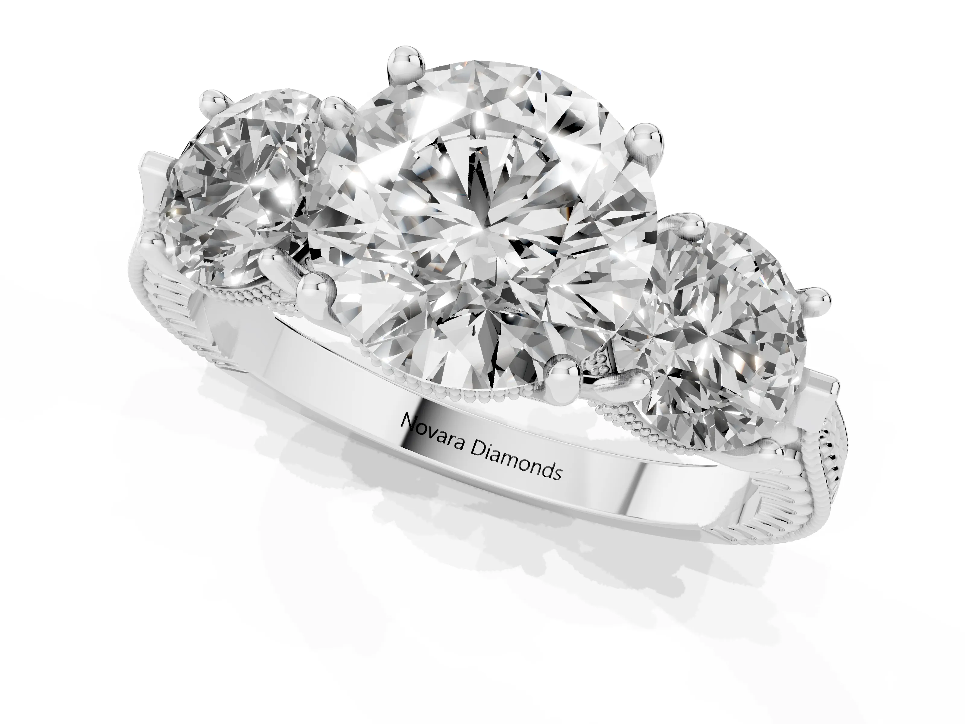 Round Cut Diamond Three-Stone Ring Set in Platinum with Milgrain Band
