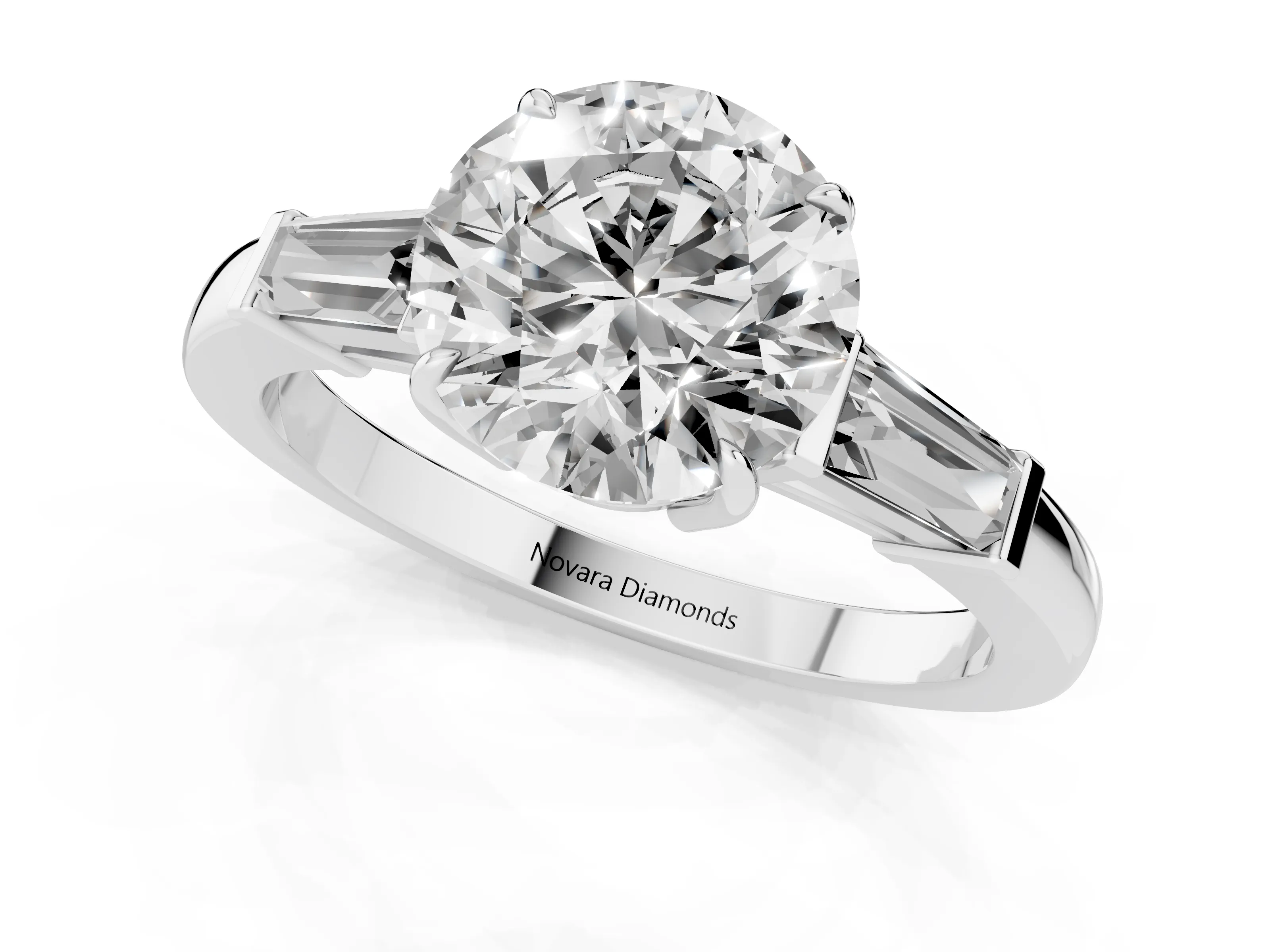 Round Cut Diamond Three-Stone Ring Set in White gold with Tapered Baguette Side Stones and Prong Setting