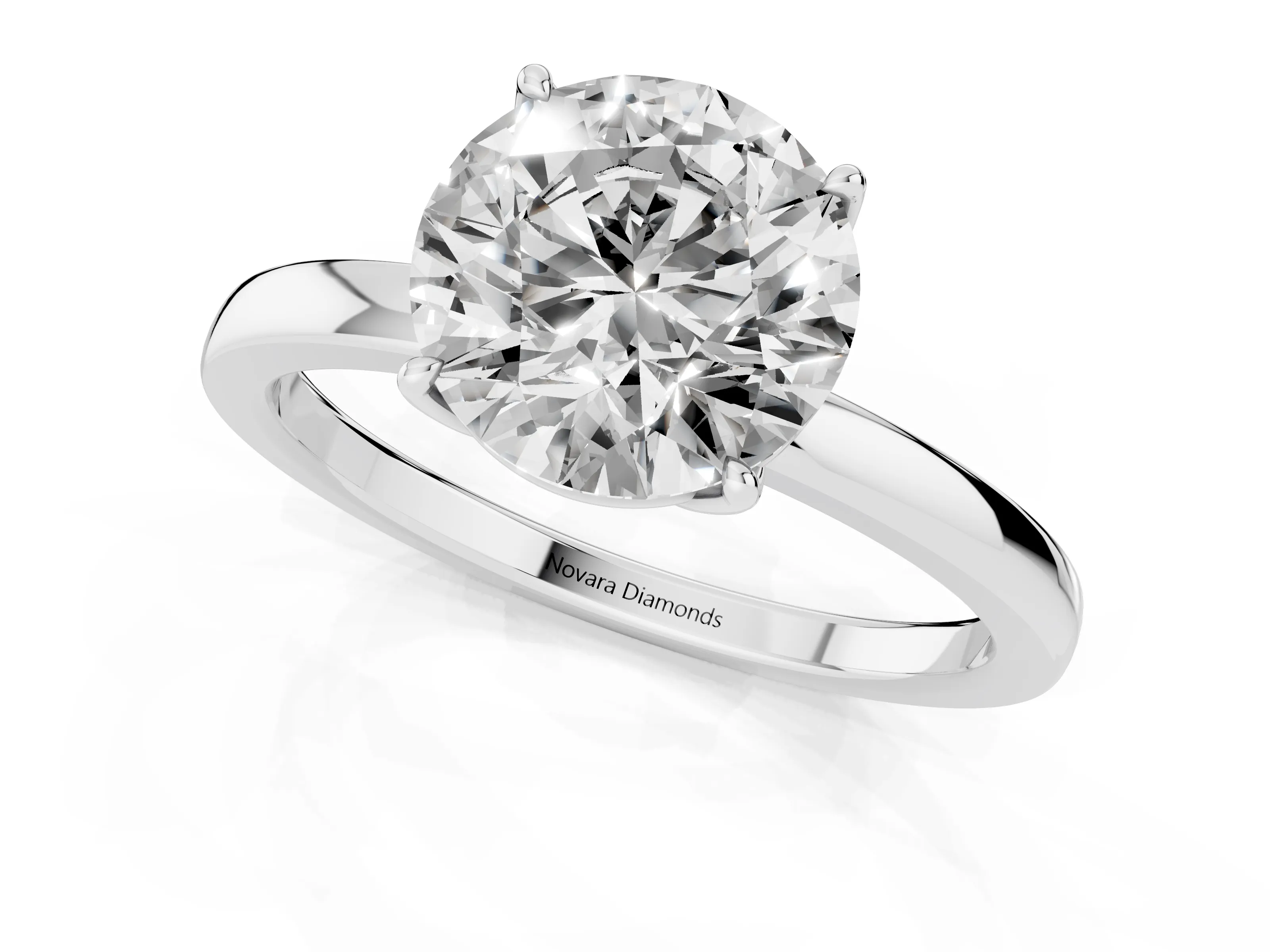 Round Cut Diamond Solitaire Ring Set in Silver with Prong Setting and Thin Polished Band