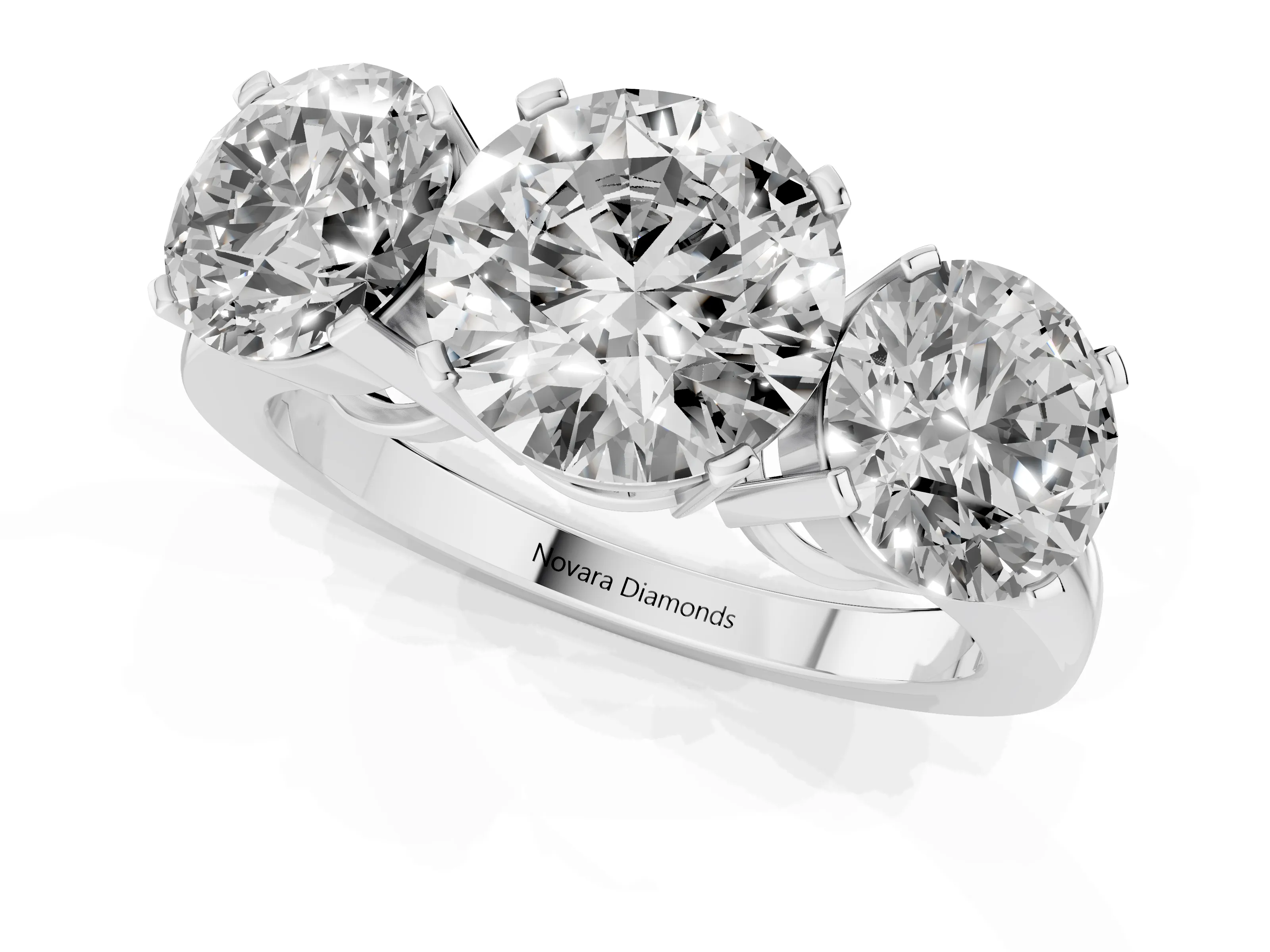 Round Cut Diamond Three-Stone Ring Set in Platinum with Channel-Set Band and Prong Settings
