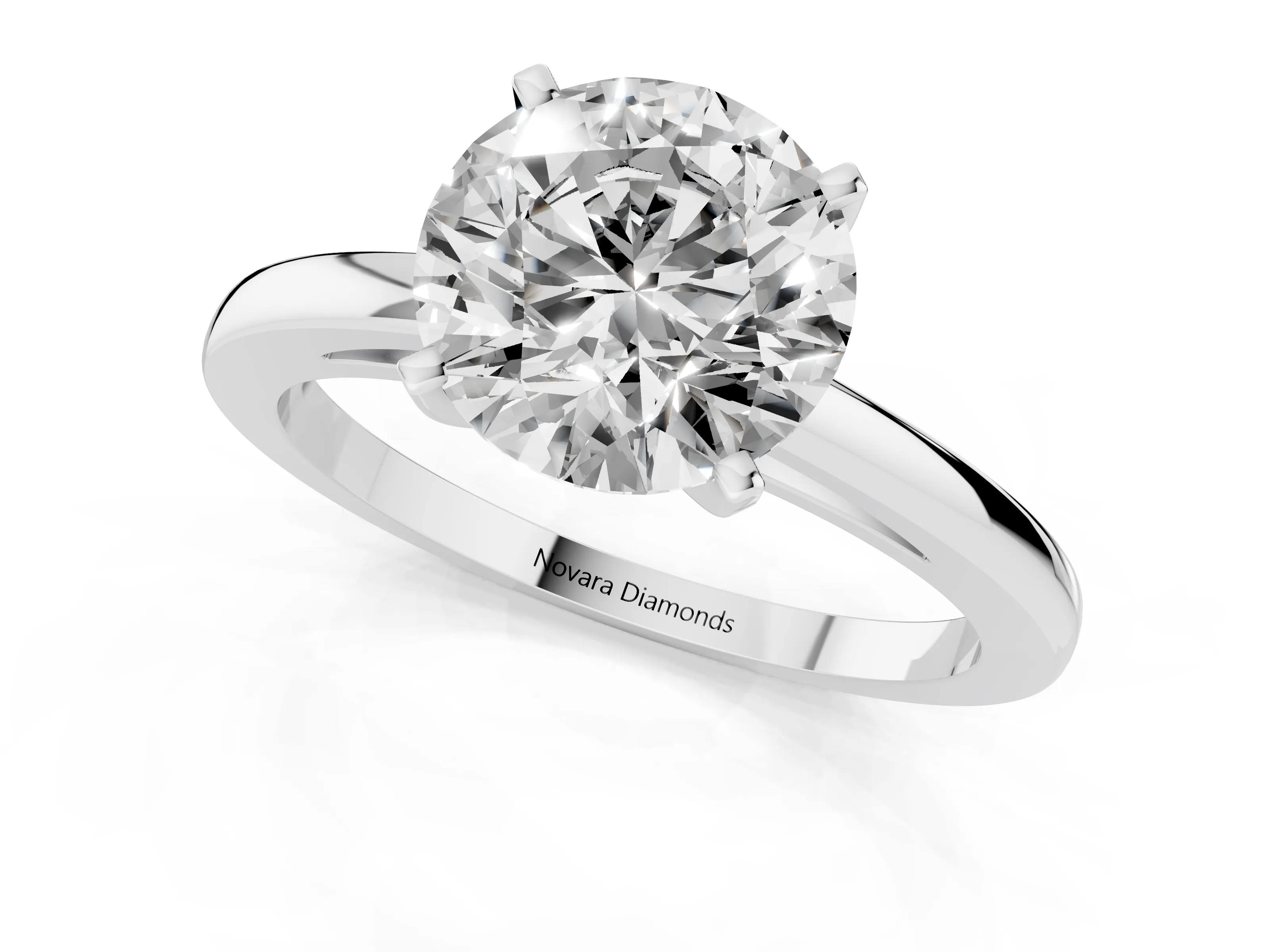 Round Cut Diamond Solitaire Engagement Ring Set in Silver with Prong Setting on a Classic Band