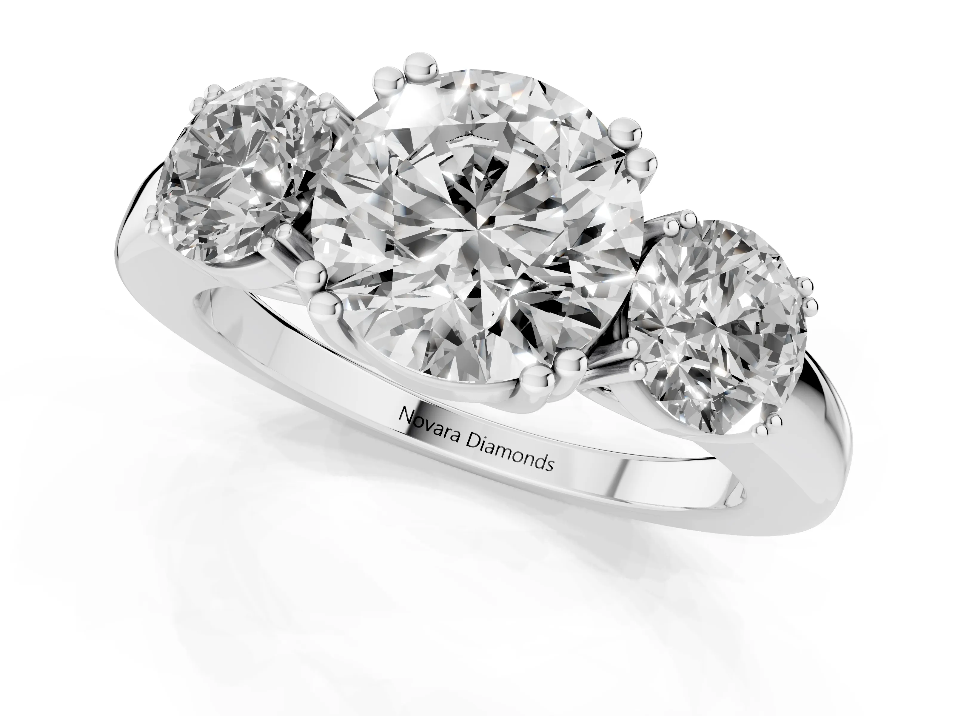 Round Cut Diamond Three-Stone Ring Set in Silver with Polished Channel-Set Band