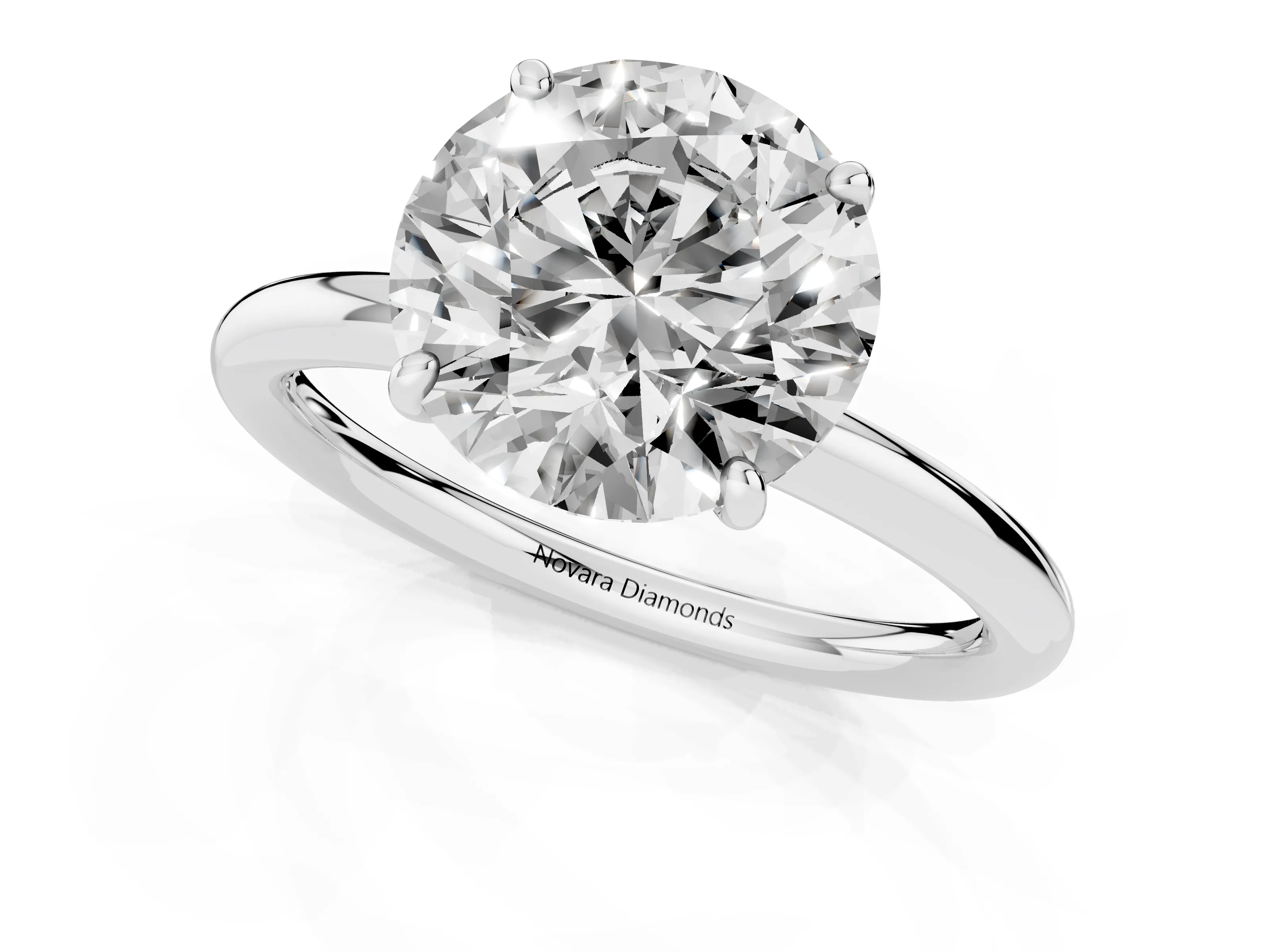 Round Cut Diamond Solitaire Ring Set in Silver with Prong Setting on a Polished Plain Band