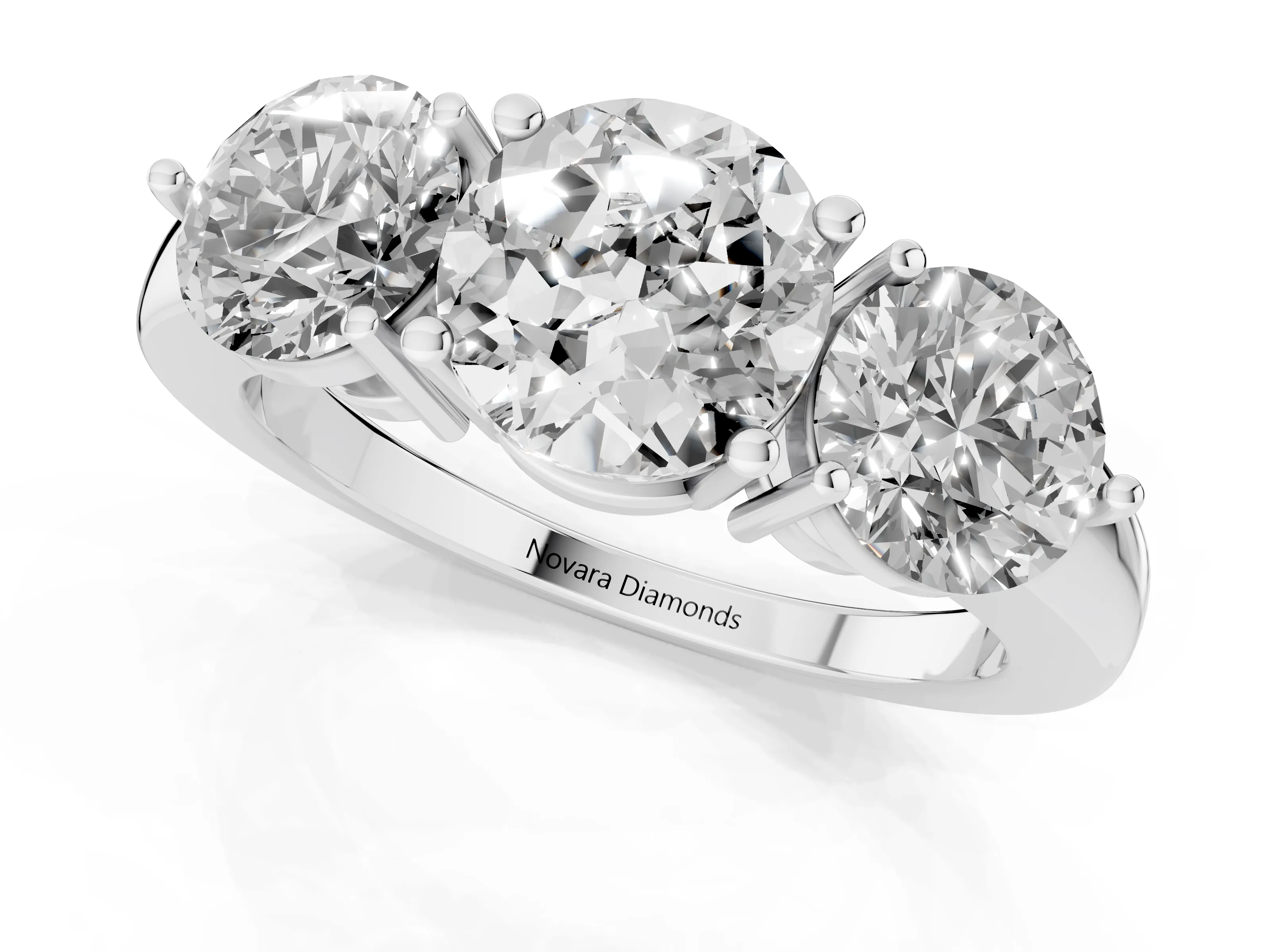 Round Cut Diamond Three-Stone Ring Set in Silver with Prong Setting and Plain Band