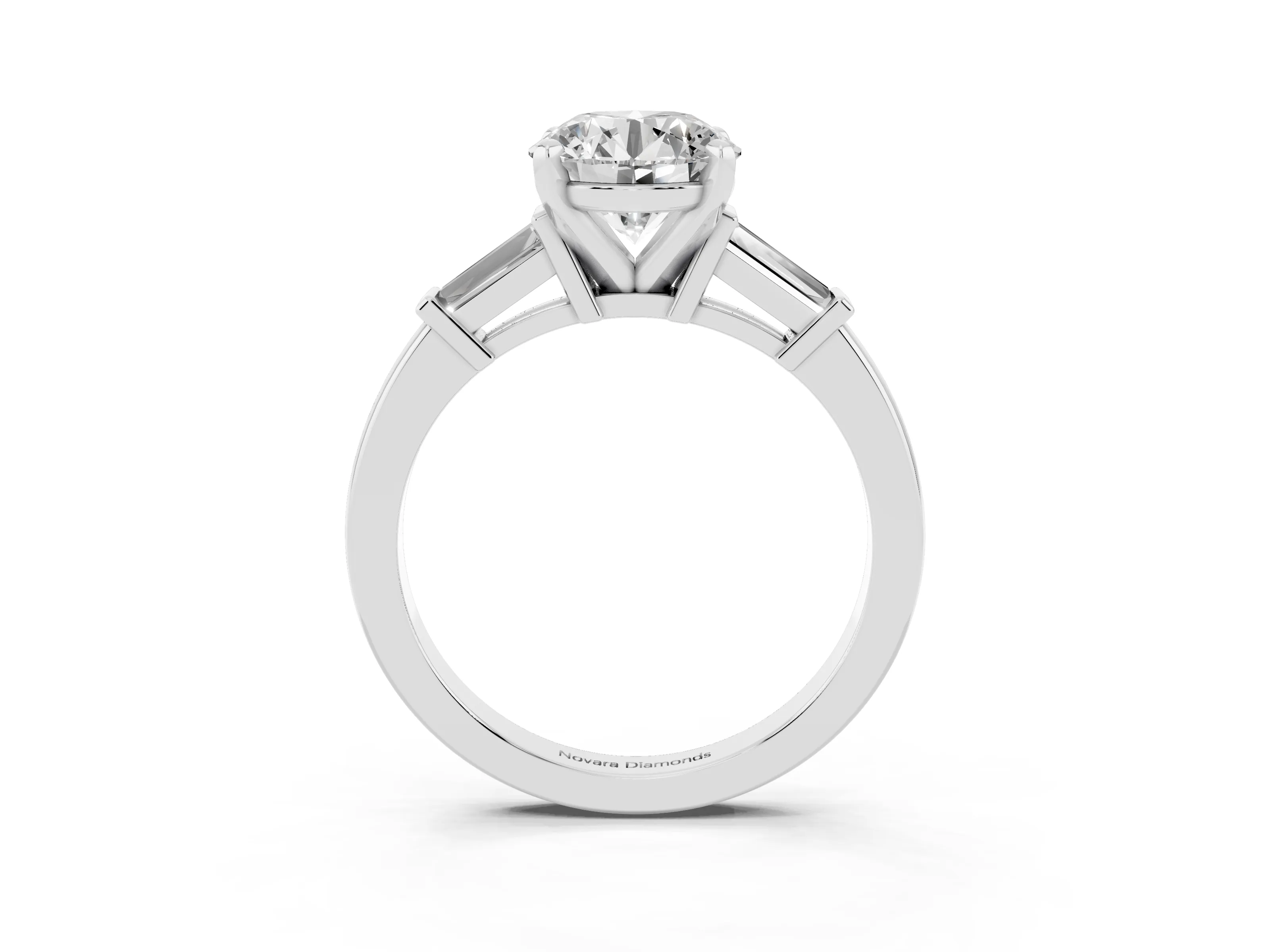 Round Cut Diamond Solitaire Ring Set in White gold with Tapered Baguette Accents and Prong Setting