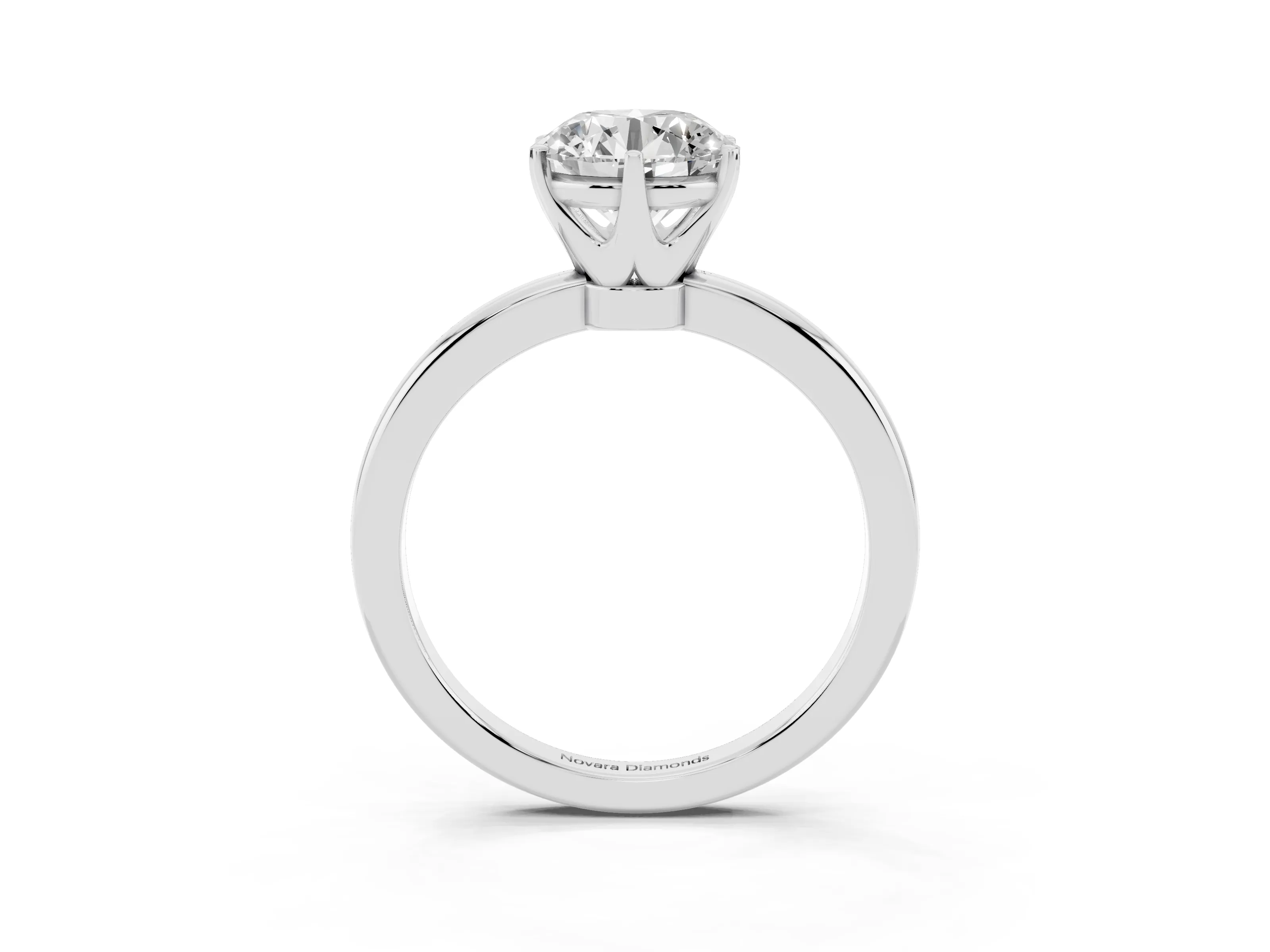 Round Cut Diamond Solitaire Ring Set in Silver with Raised Prong Setting on a Classic Band