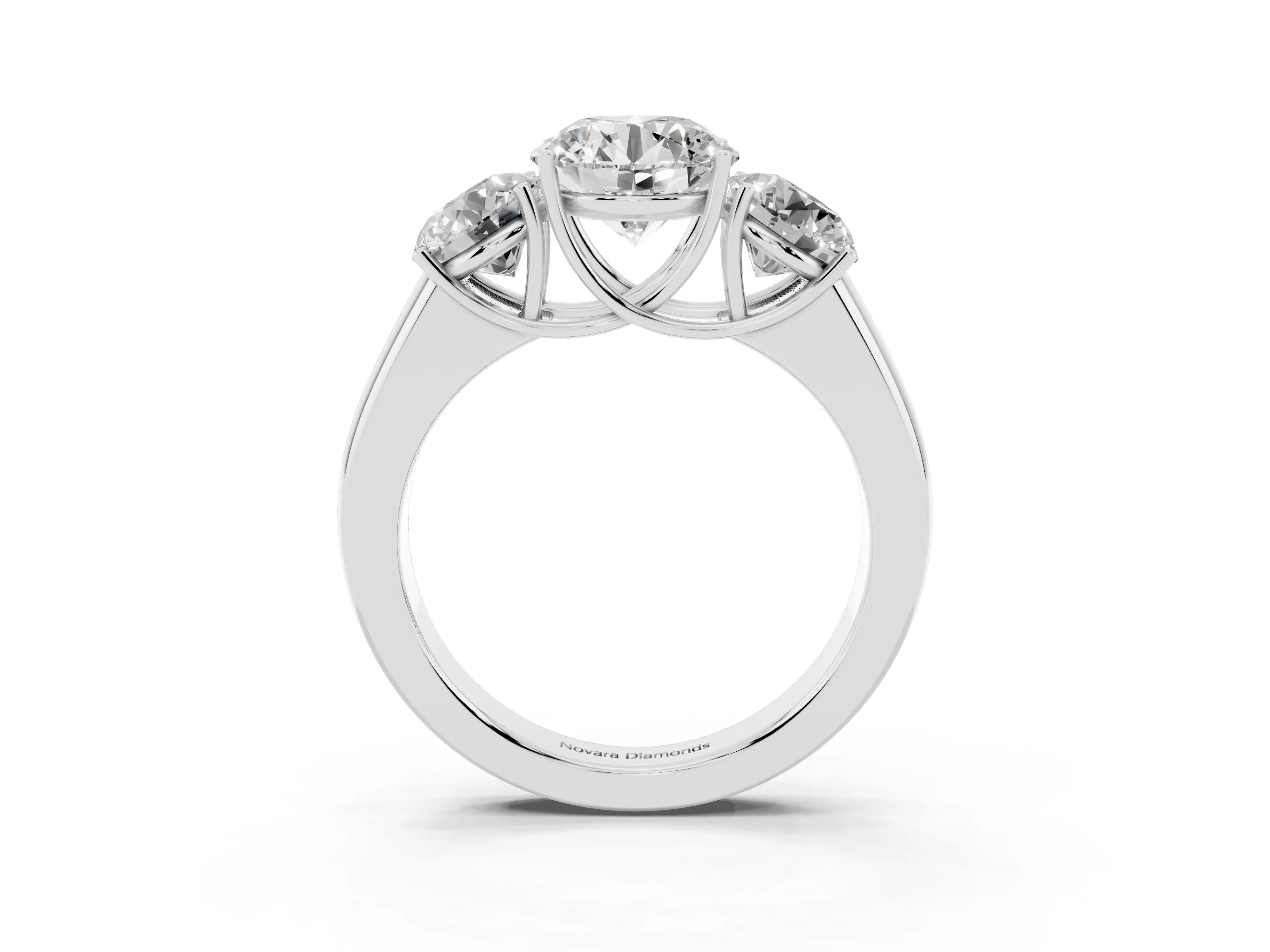 Three-Stone Round Cut Diamond Ring Set in Silver with Matching Prong Settings and Plain Band