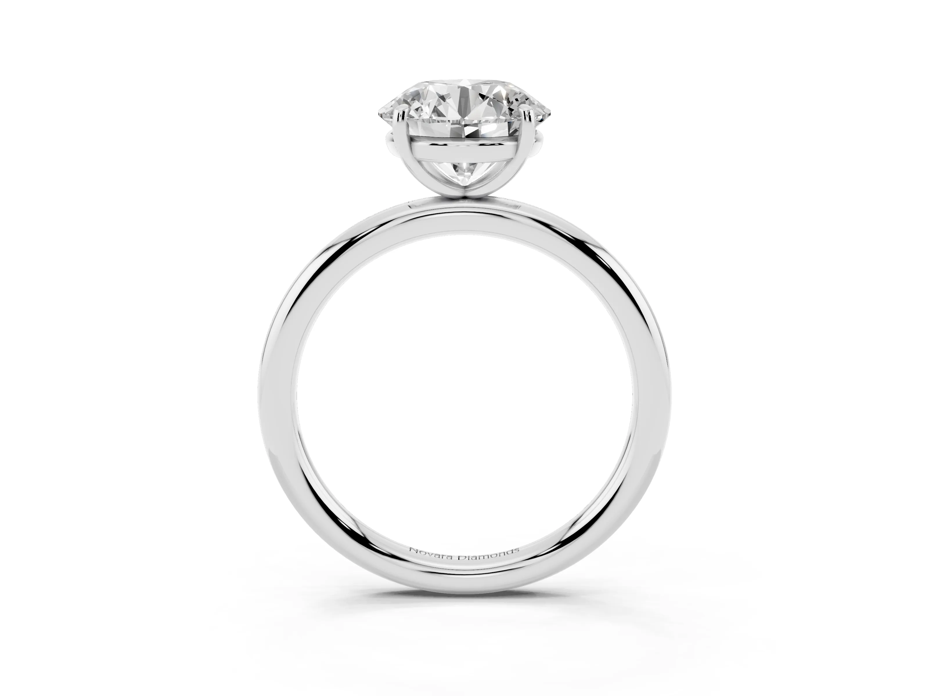 Round Cut Diamond Solitaire Ring Set in Silver with Prong Setting on a Polished Plain Band