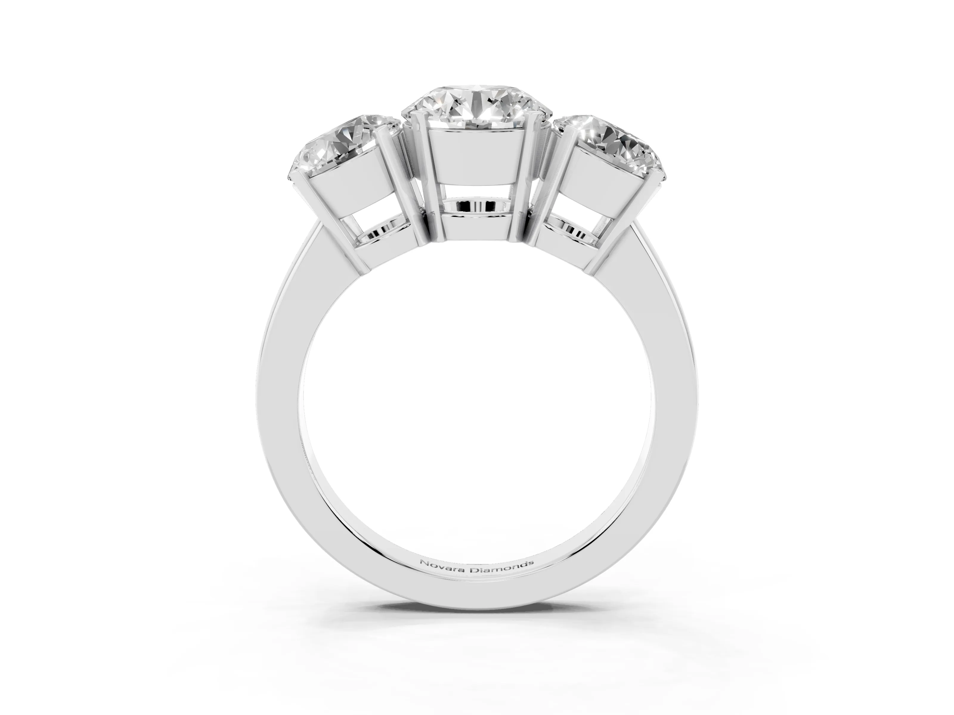 Round Cut Diamond Three-Stone Ring Set in Platinum with Channel-Set Band and Prong Settings