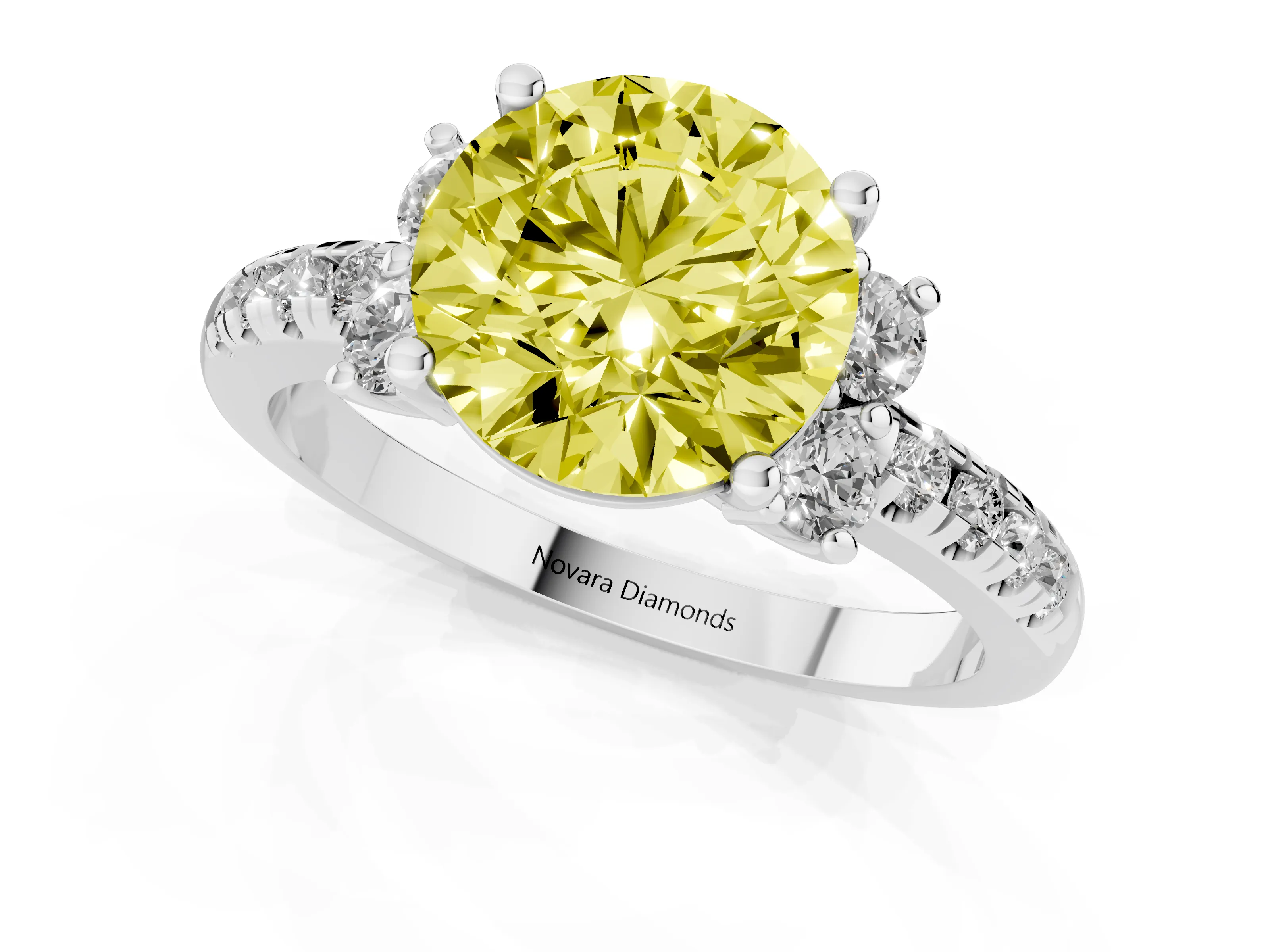Fancy Yellow Round Cut Diamond Three-Stone Pavé Ring Set in White gold with Prong Setting