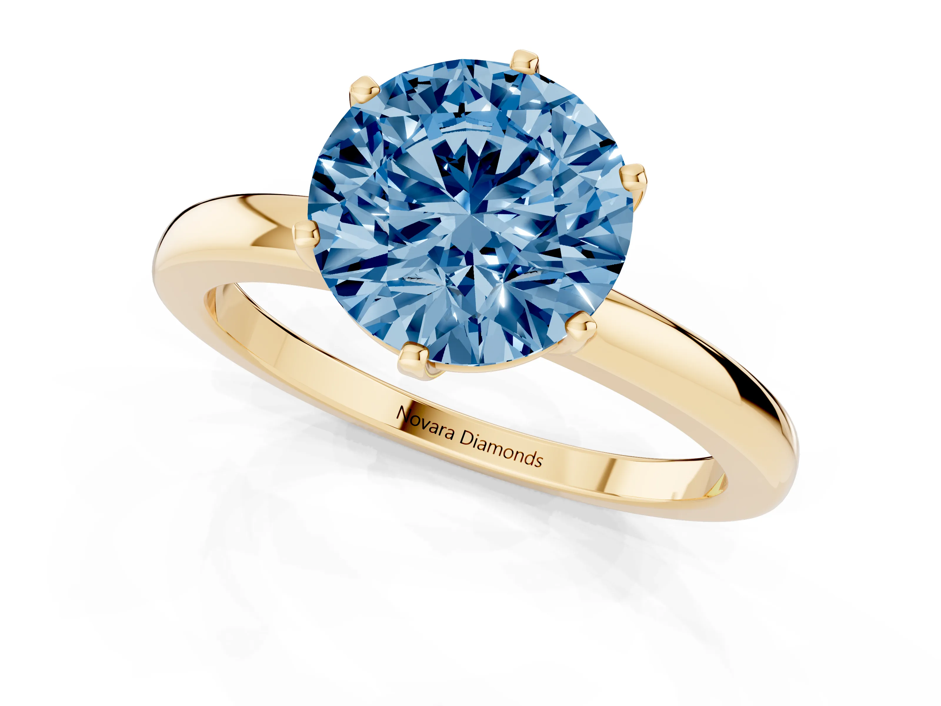 Fancy Blue Round Cut Diamond Solitaire Ring Set in Yellow gold with Raised Prong Setting on a Classic Band