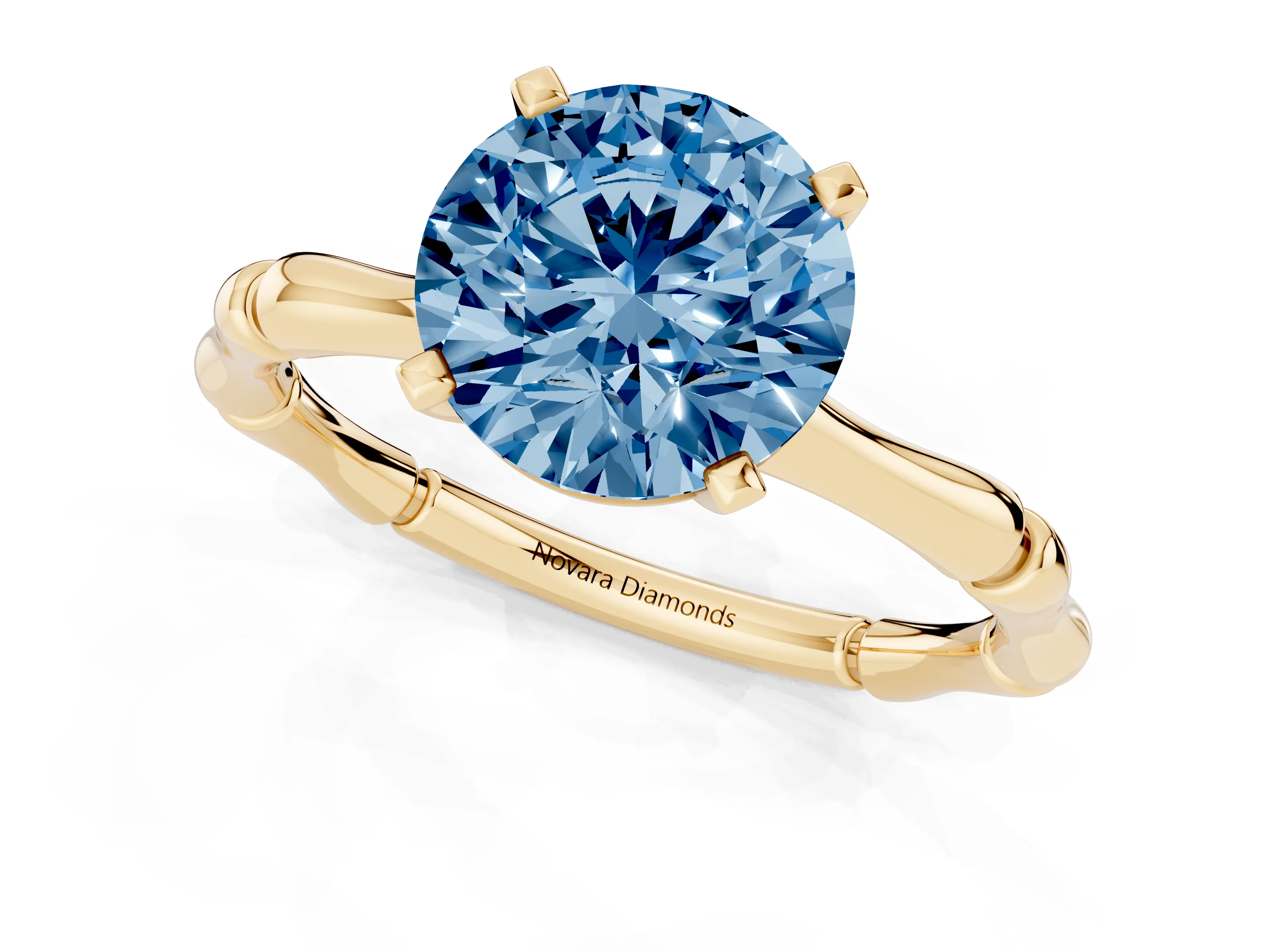 Fancy Blue Round Cut Diamond Solitaire Ring Set in Yellow gold with Bamboo Band and Prong Setting
