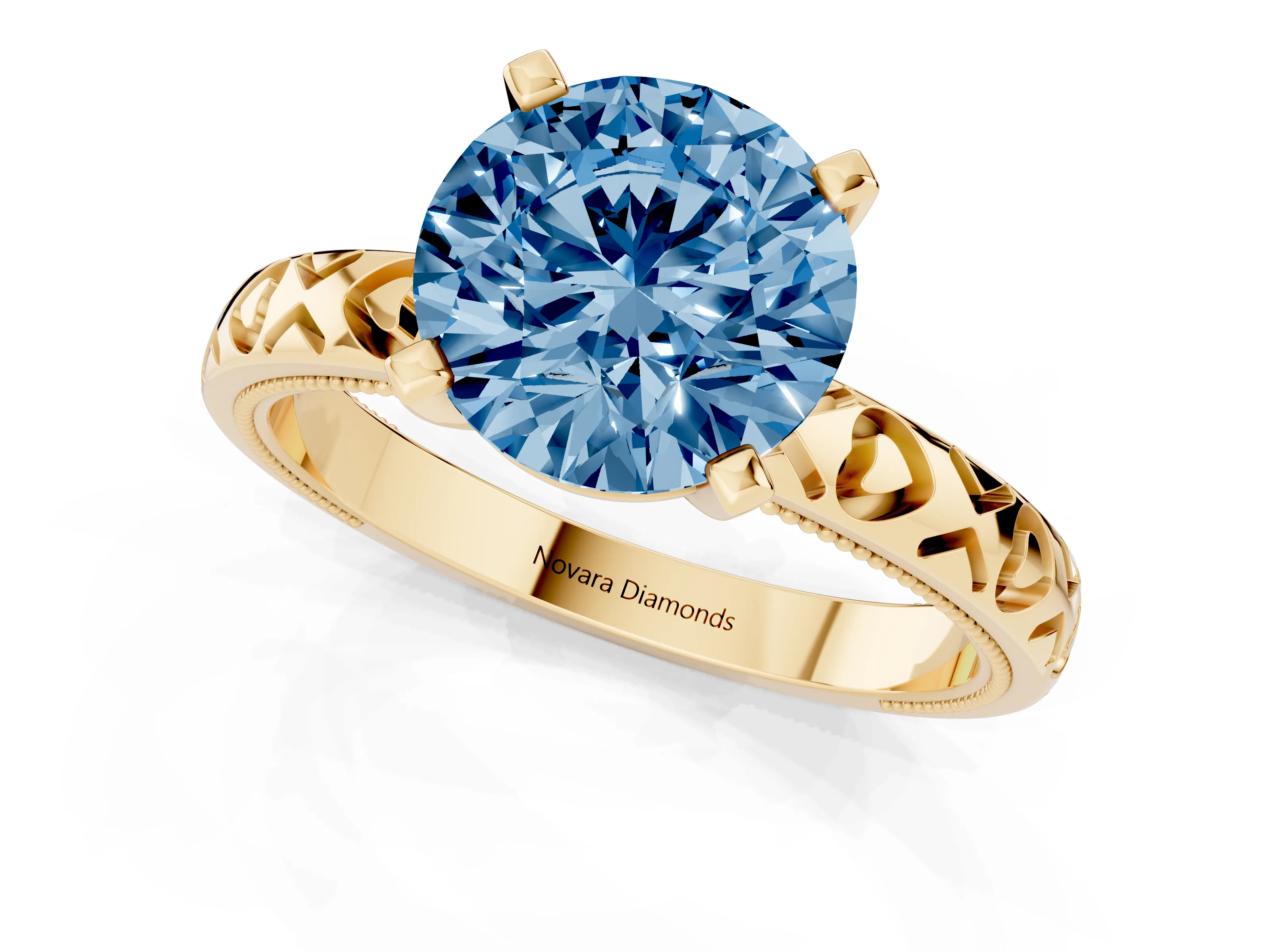 Fancy Blue Round Cut Diamond Solitaire Engagement Ring Set in Yellow gold with XO Engraved Band and Prong Setting