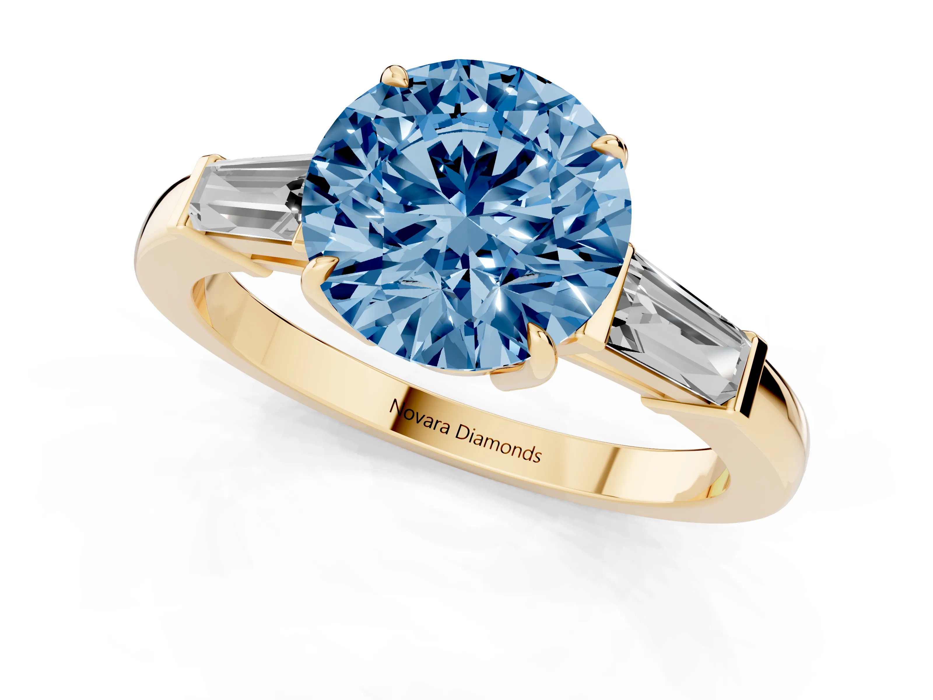 Fancy Blue Round Cut Diamond Three-Stone Ring Set in Yellow gold with Tapered Baguette Side Stones and Prong Setting