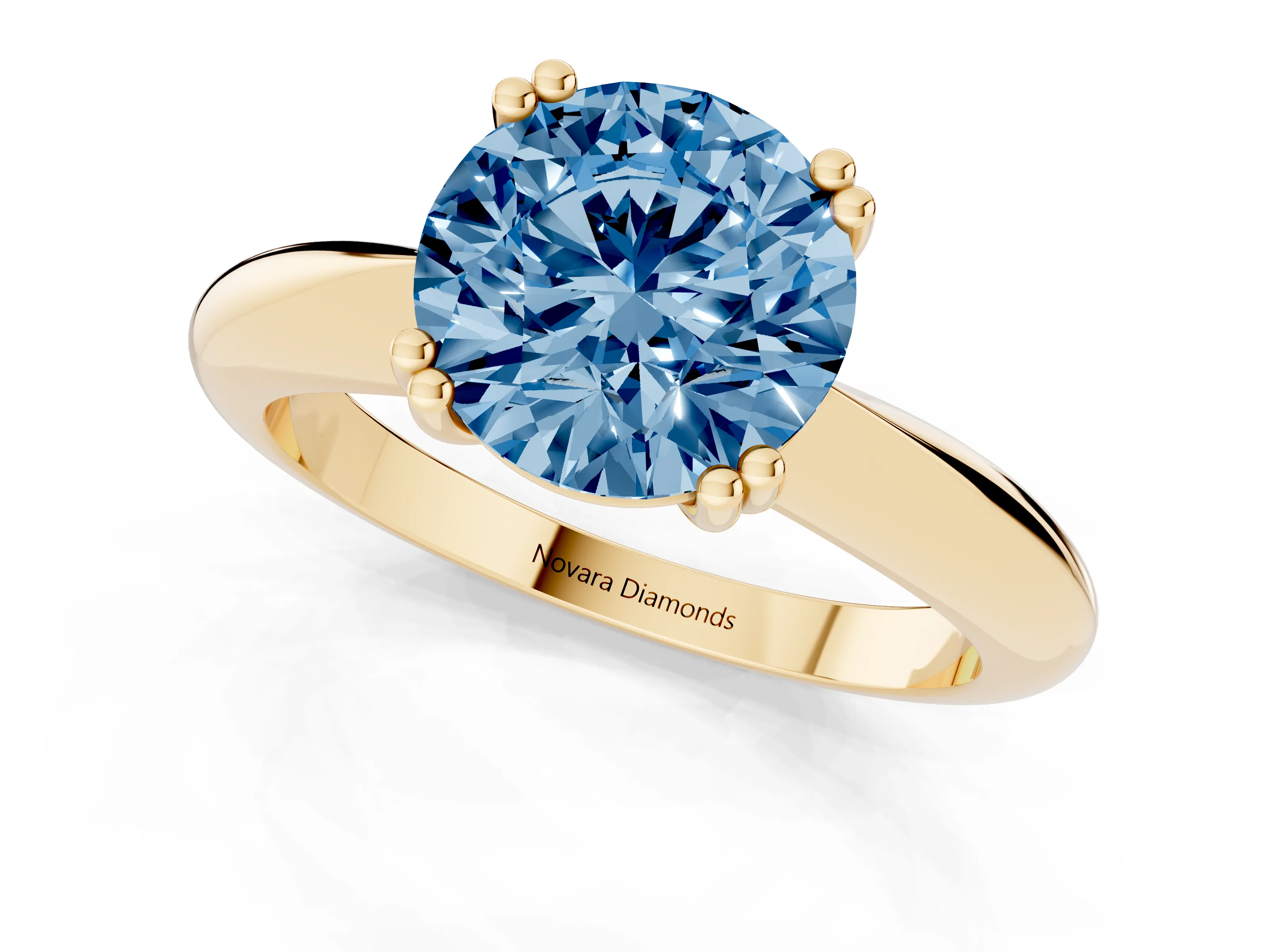 Fancy Blue Round Cut Diamond Solitaire Engagement Ring Set in Yellow gold with Tapered Band and Prong Setting