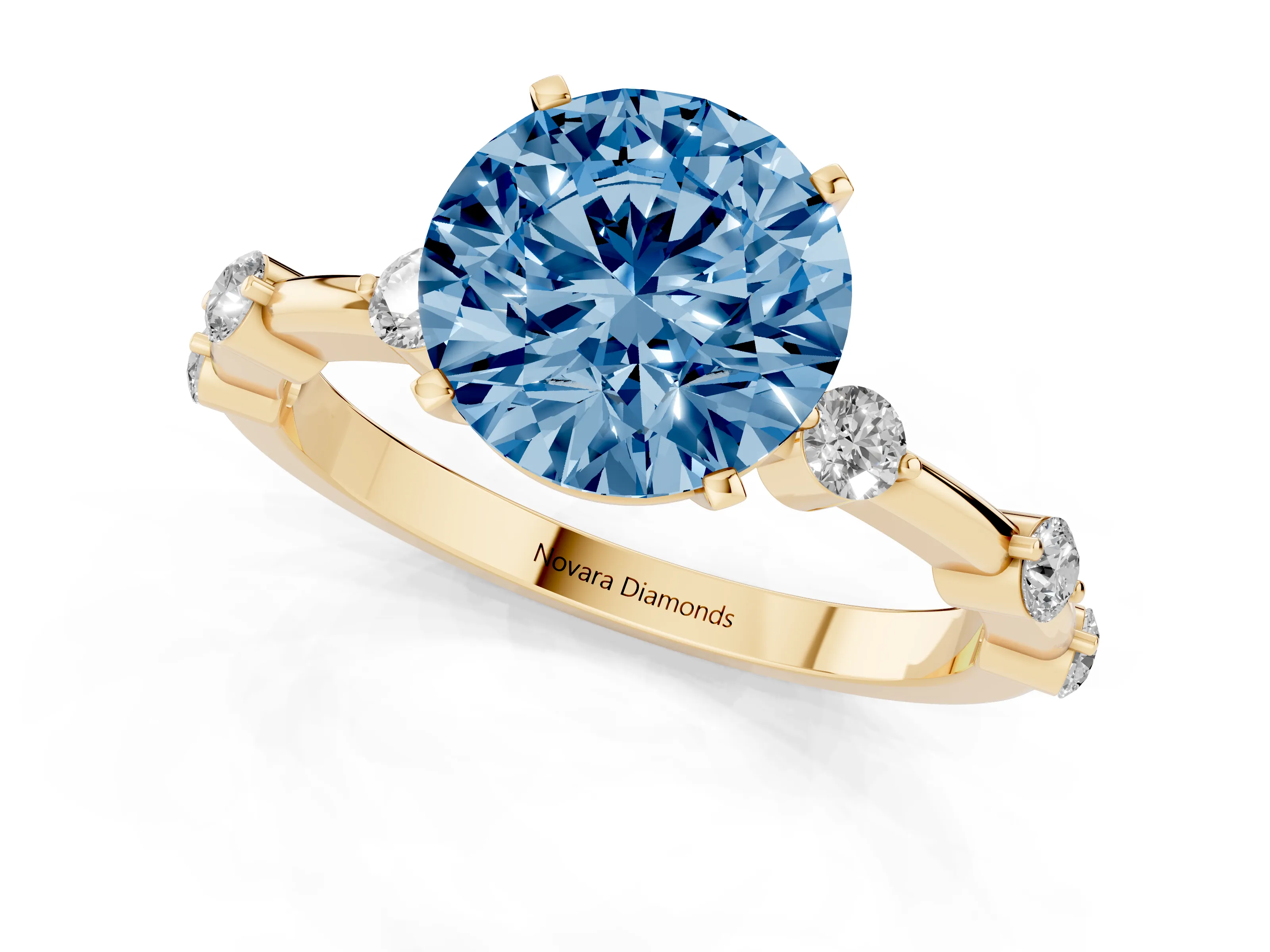 Fancy Blue Round Cut Diamond Solitaire Ring Set in Yellow gold with Bezel Set Side Stones and Prong Setting