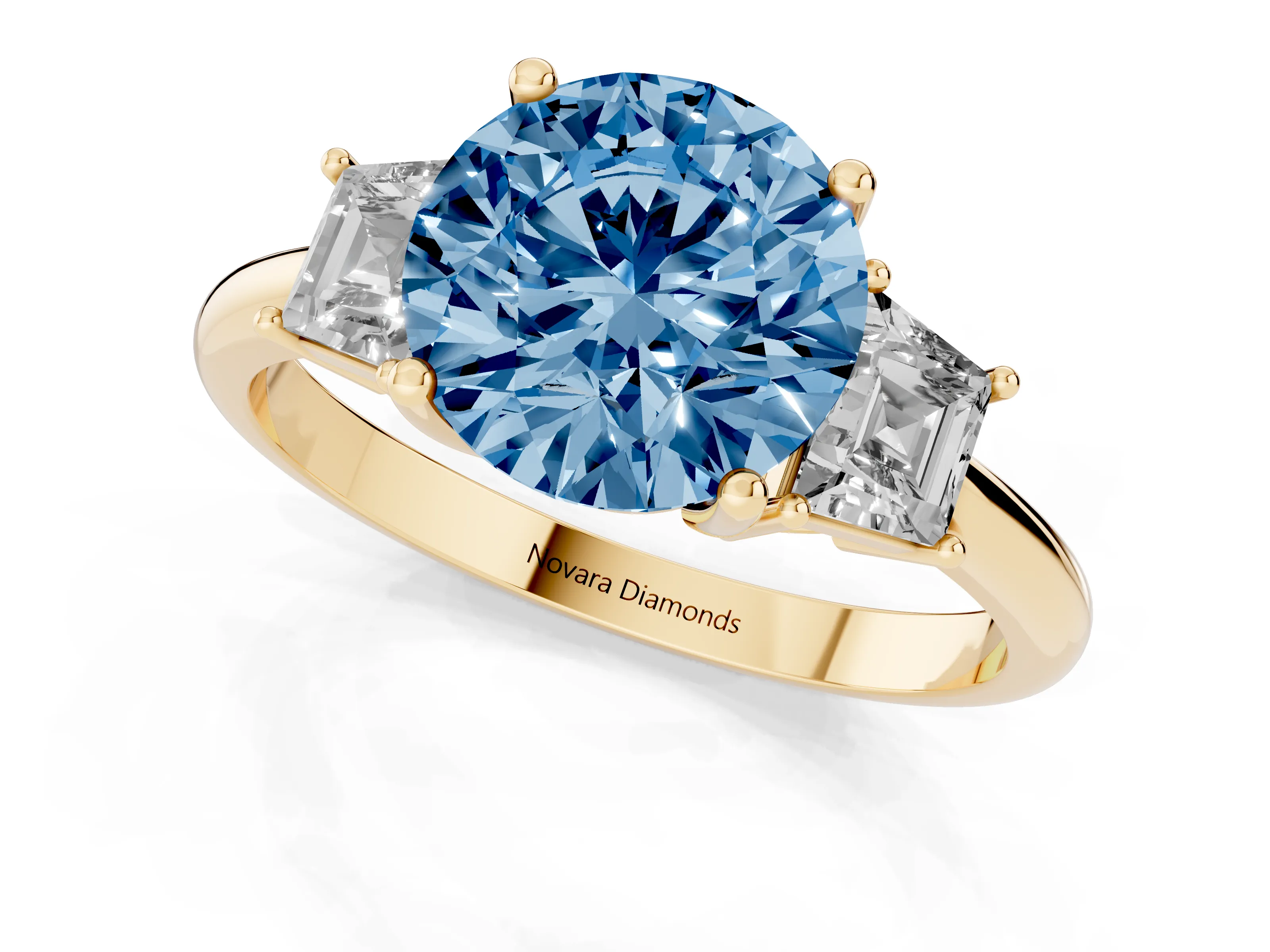 Fancy Blue Round Cut Diamond Three-Stone Ring Set in Yellow gold with Trapezoid Side Stones and Prong Setting