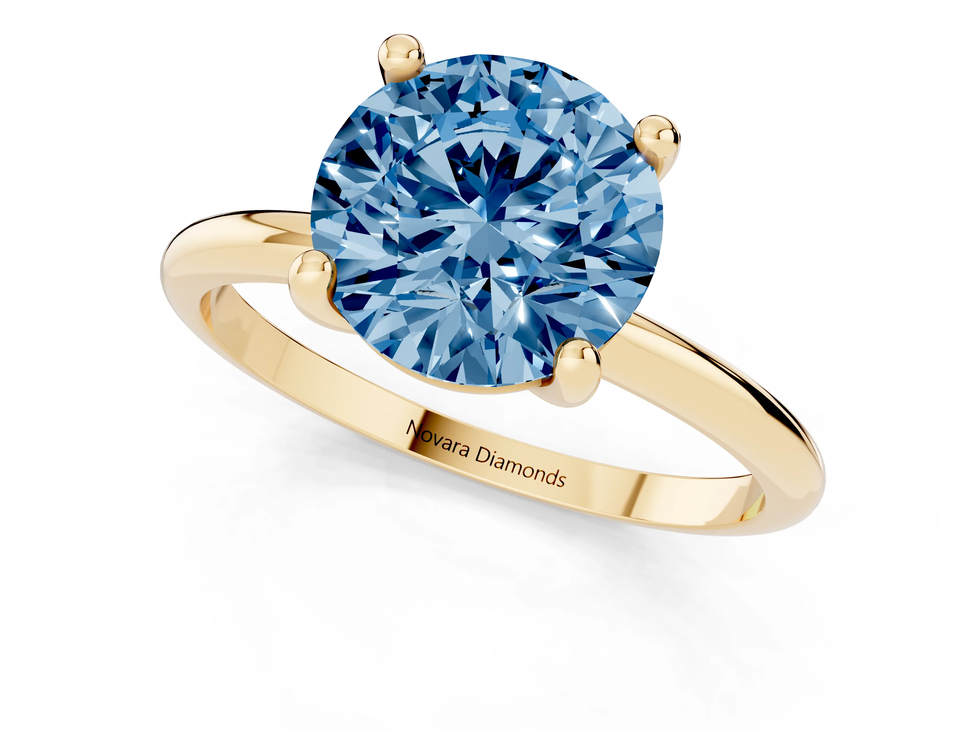 Fancy Blue Round Cut Diamond Solitaire Ring Set in Yellow gold with Secure Prong Setting on a Classic Band