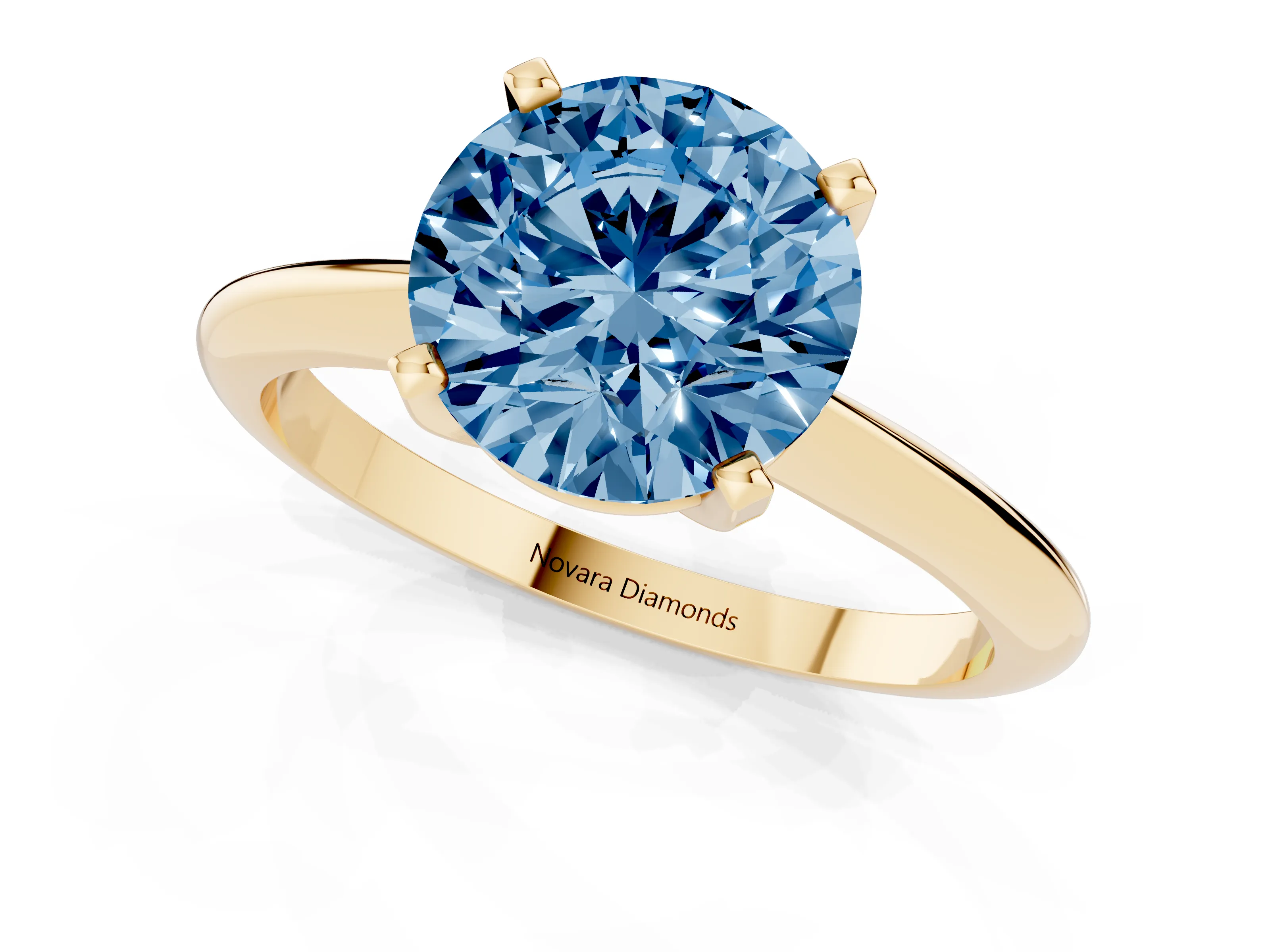 Fancy Blue Round Cut Diamond Solitaire Ring Set in Yellow gold with Prong Setting on a Plain Round Band