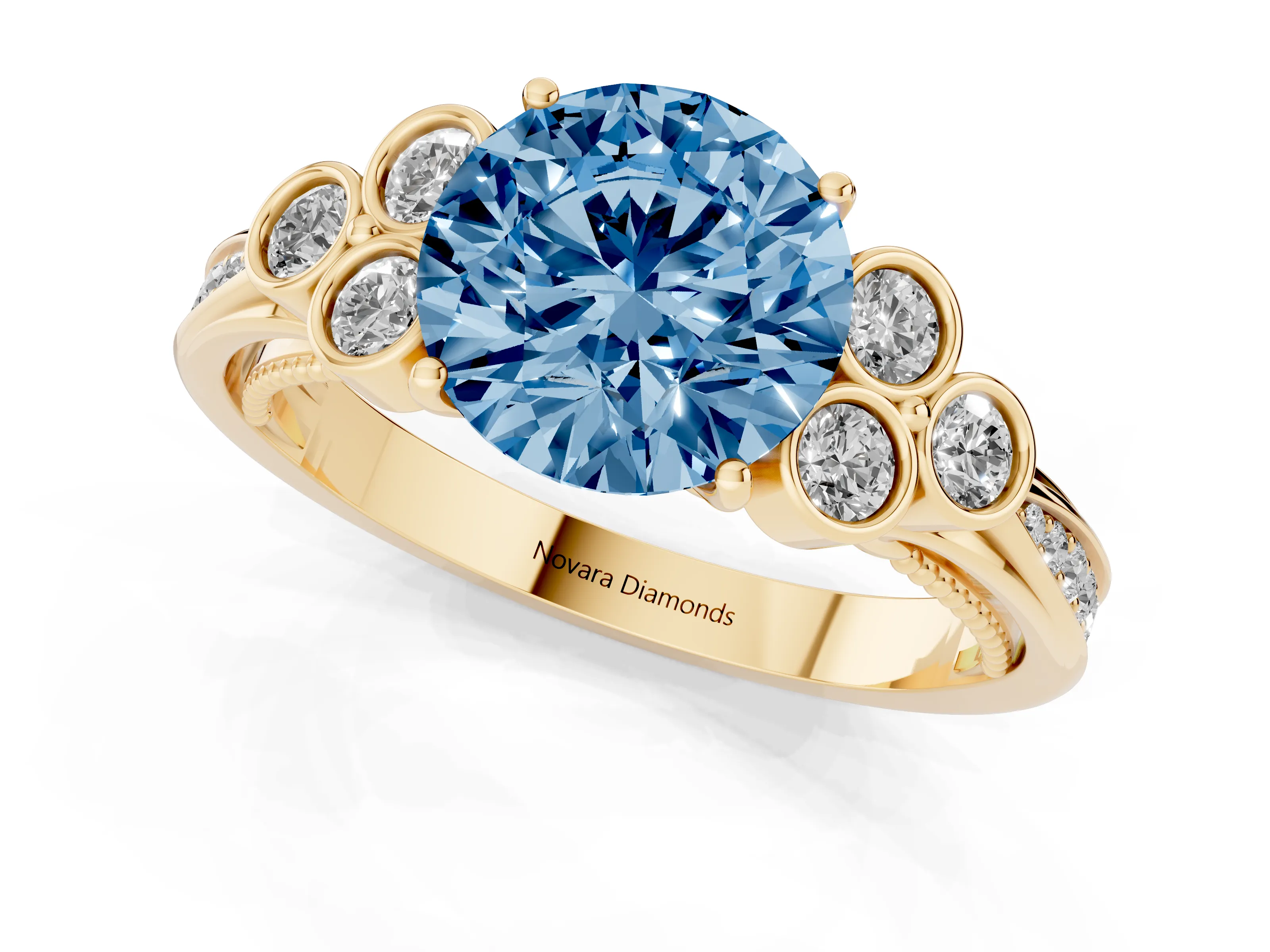 Fancy Blue Round Cut Diamond Engagement Ring Set in Yellow gold with Bezel Set Round Side Stones and Prong Setting