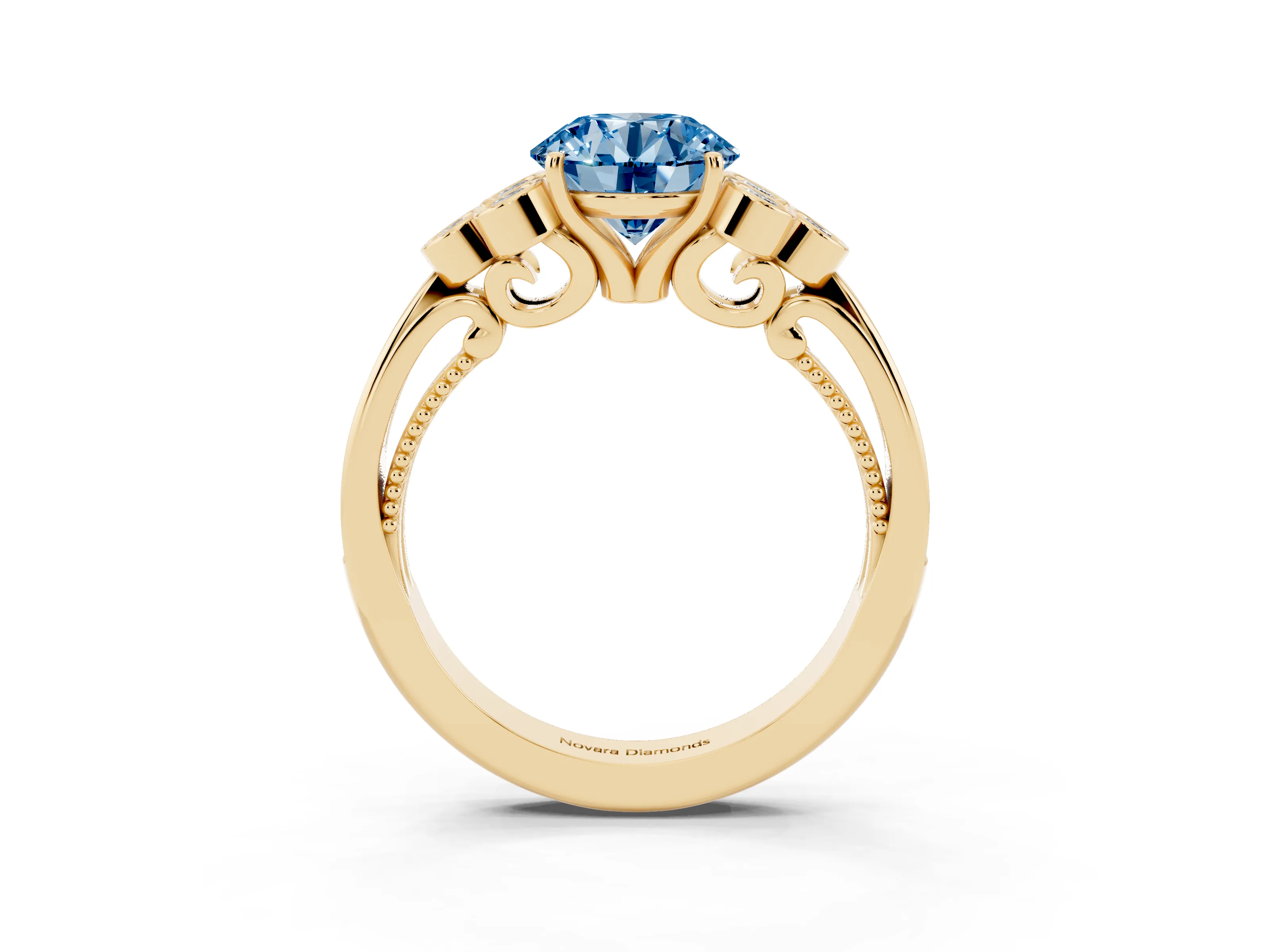 Fancy Blue Round Cut Diamond Engagement Ring Set in Yellow gold with Bezel Set Round Side Stones and Prong Setting
