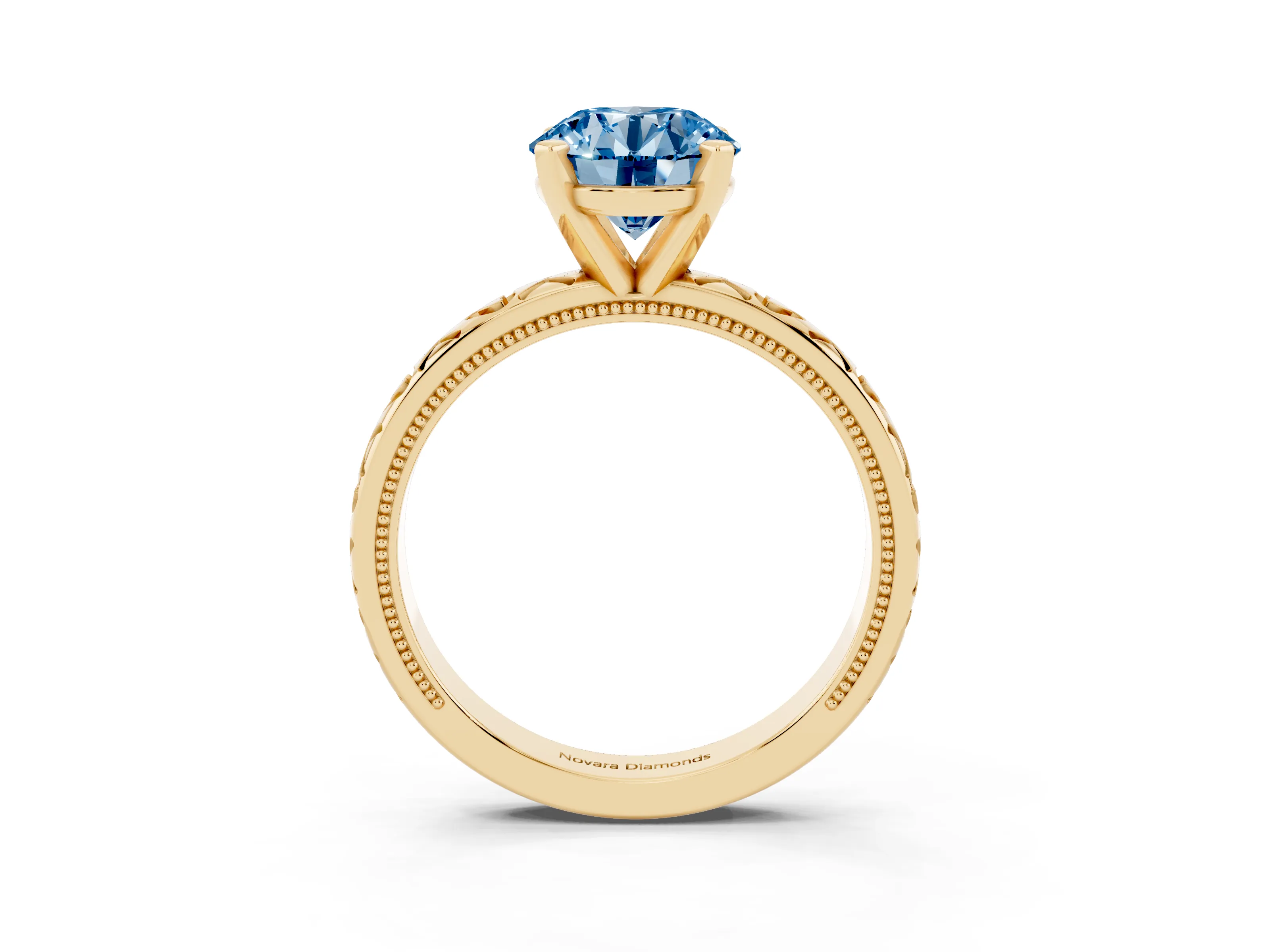 Fancy Blue Round Cut Diamond Solitaire Engagement Ring Set in Yellow gold with XO Engraved Band and Prong Setting