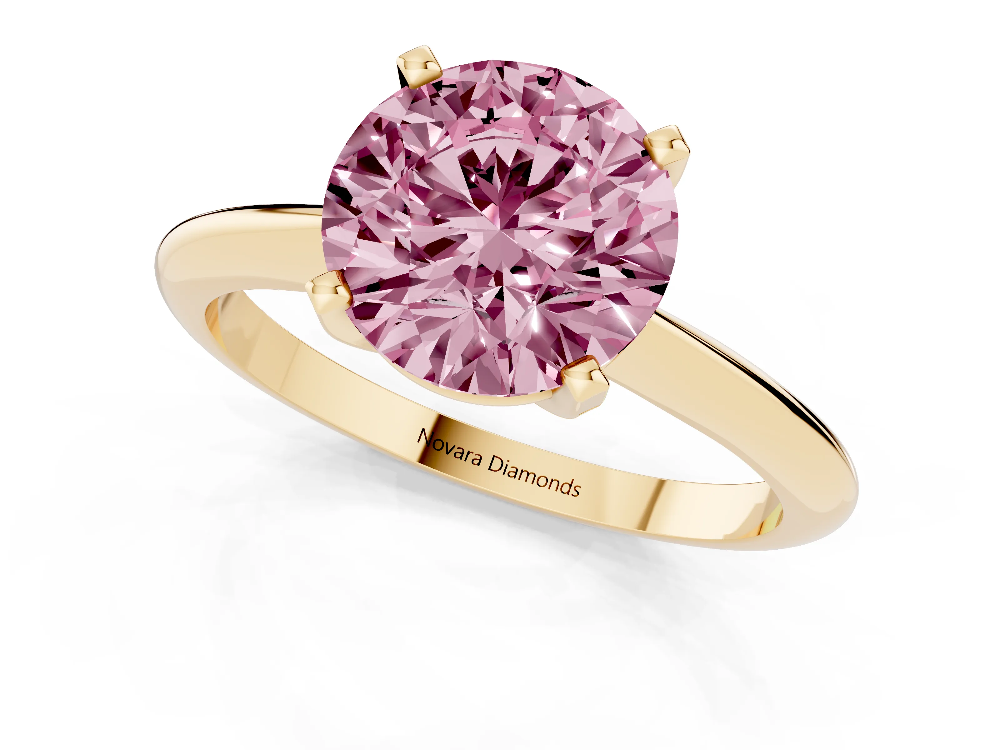Fancy Pink Round Cut Diamond Solitaire Ring Set in Yellow gold with Prong Setting on a Plain Round Band