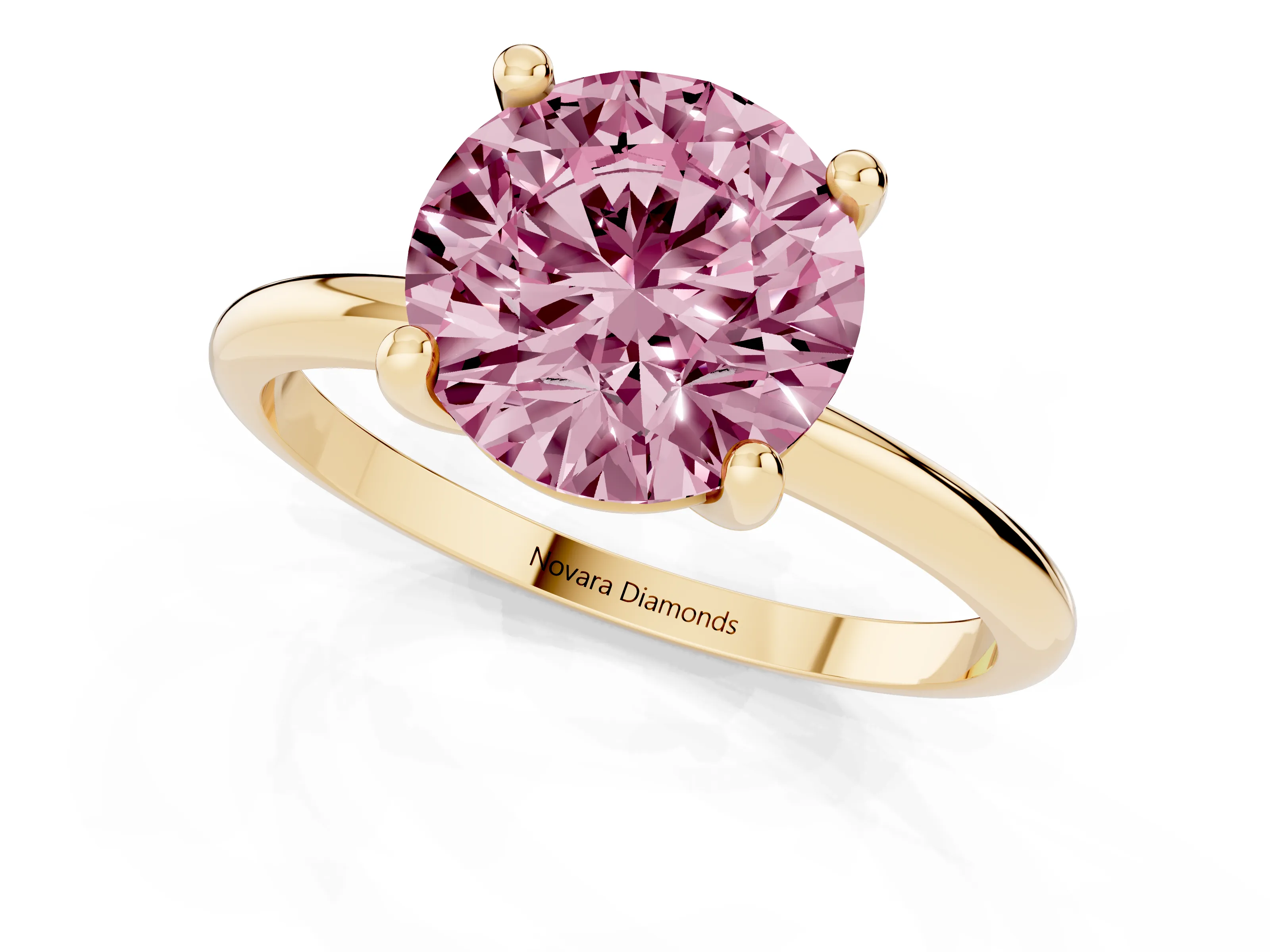 Fancy Pink Round Cut Diamond Solitaire Ring Set in Yellow gold with Secure Prong Setting on a Classic Band