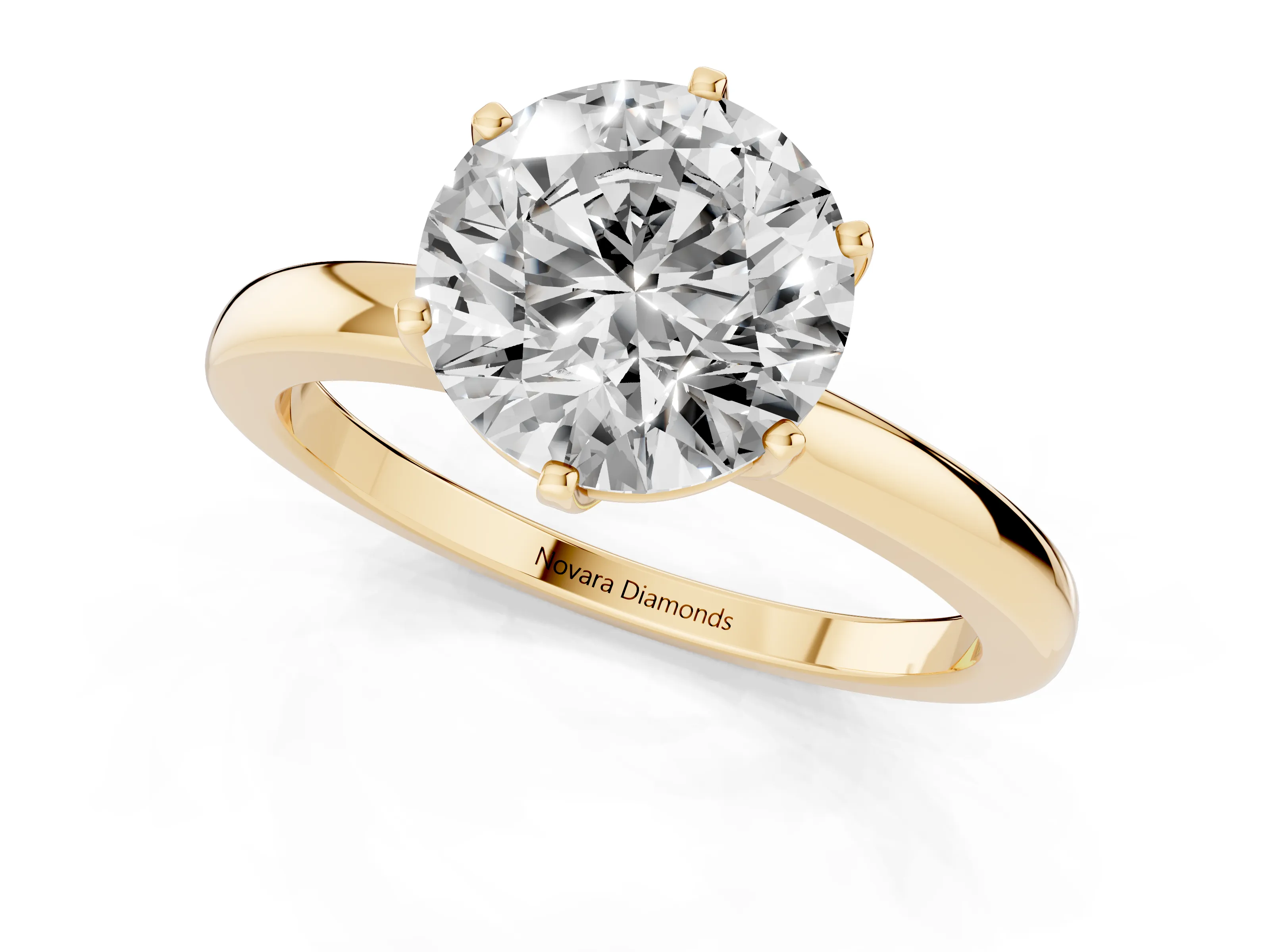 Round Cut Diamond Solitaire Ring Set in Yellow gold with Raised Prong Setting on a Classic Band
