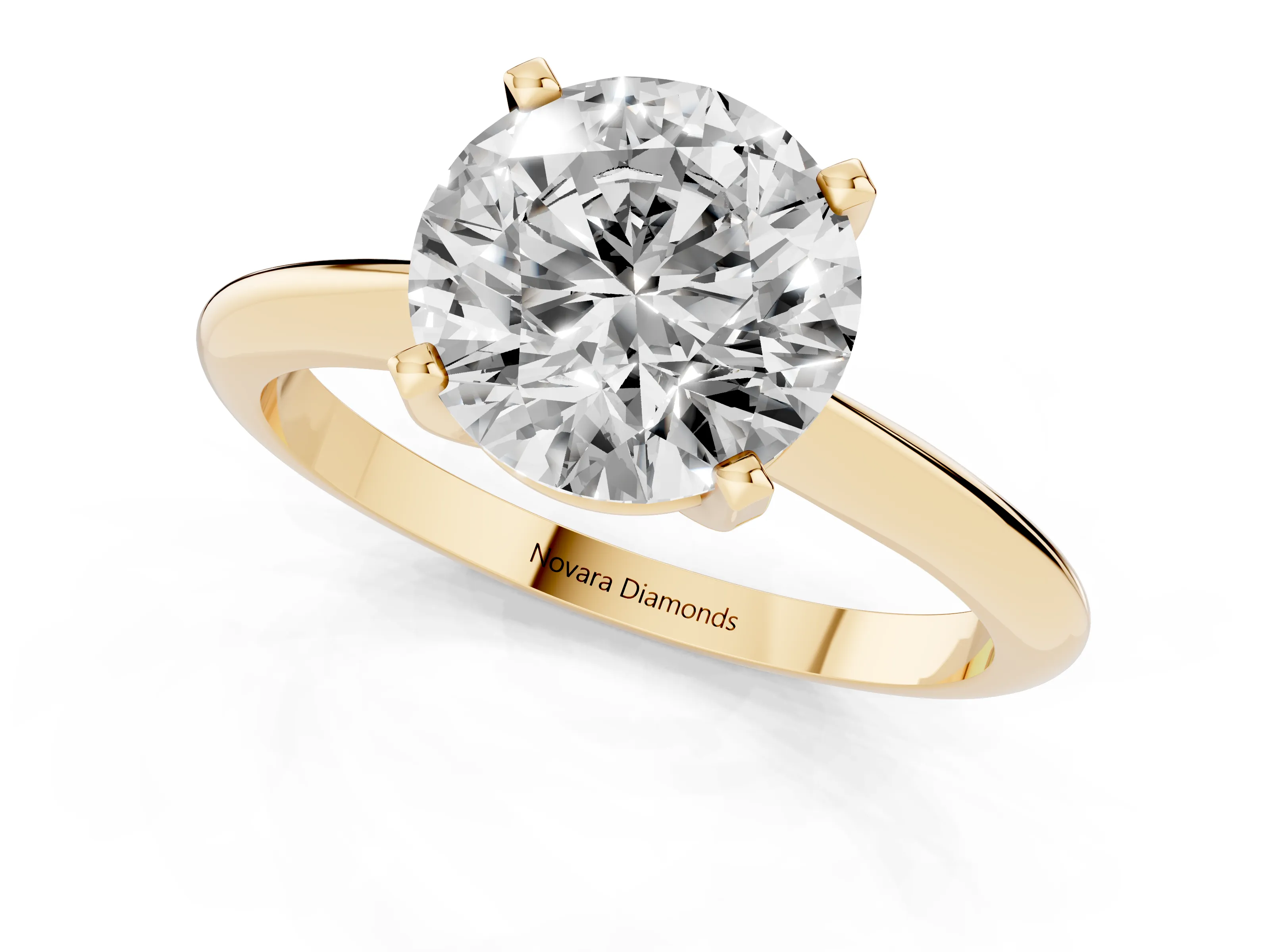 Round Cut Diamond Solitaire Ring Set in Yellow gold with Prong Setting on a Plain Round Band