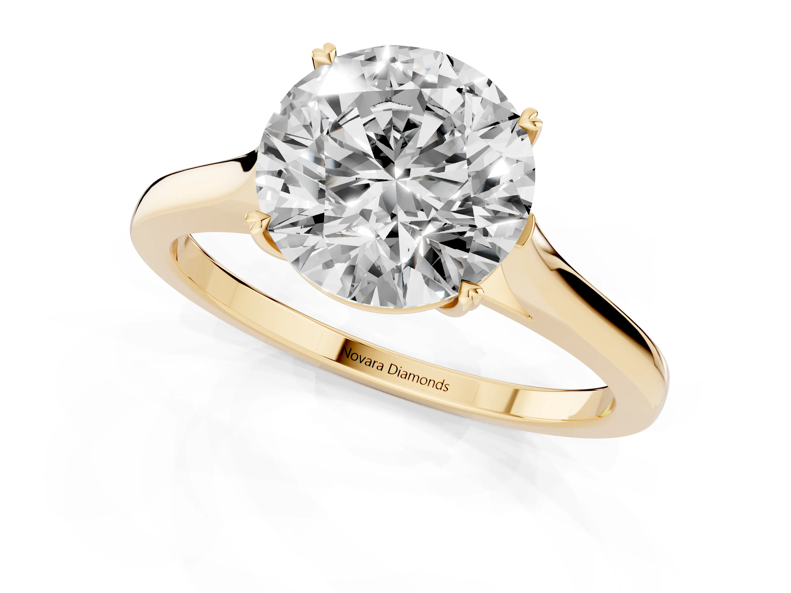 Round Cut Diamond Solitaire Heart Prong Engagement Ring Set in Yellow gold with Tapered Band