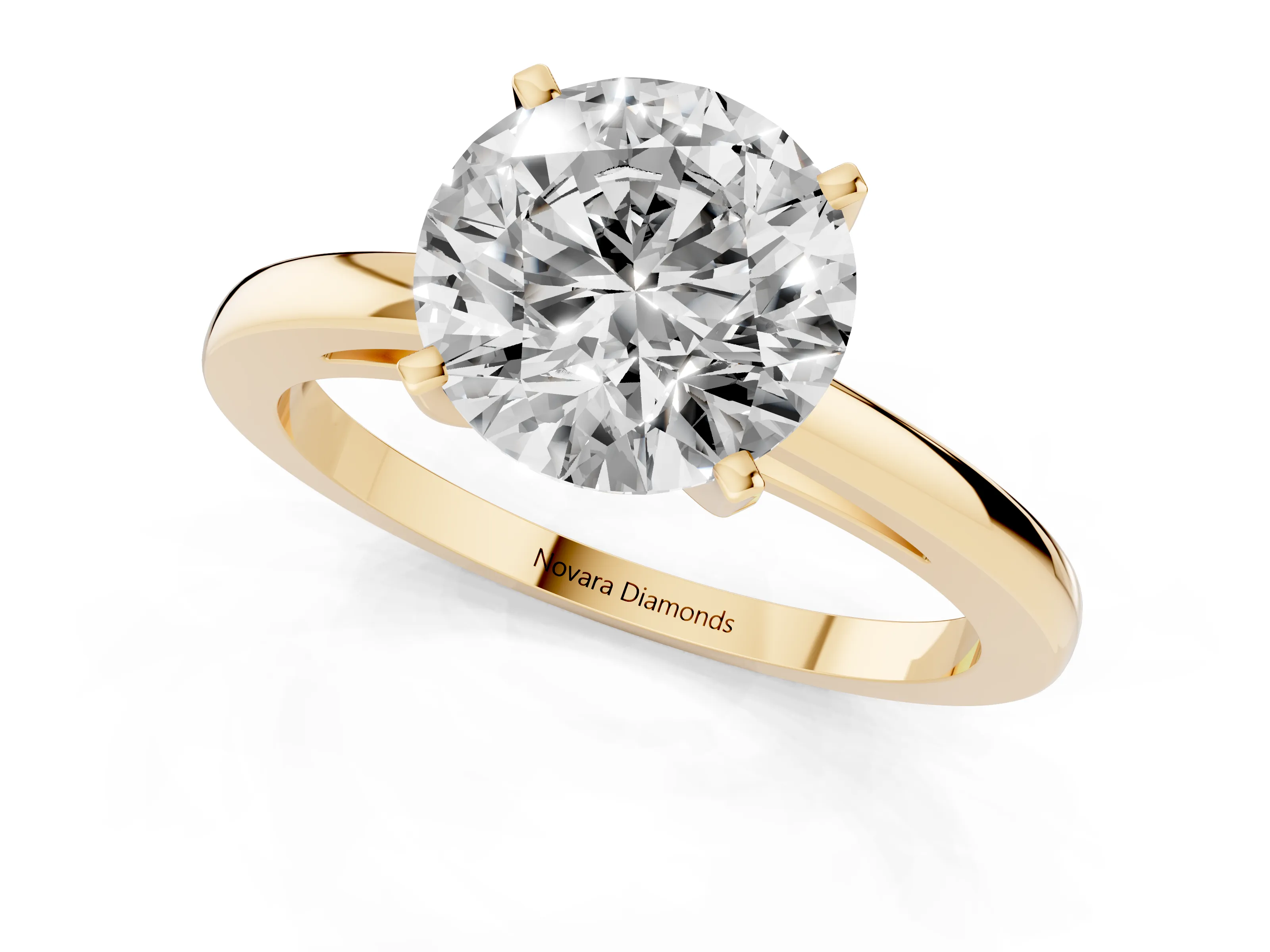 Round Cut Diamond Solitaire Engagement Ring Set in Yellow gold with Prong Setting on a Classic Band