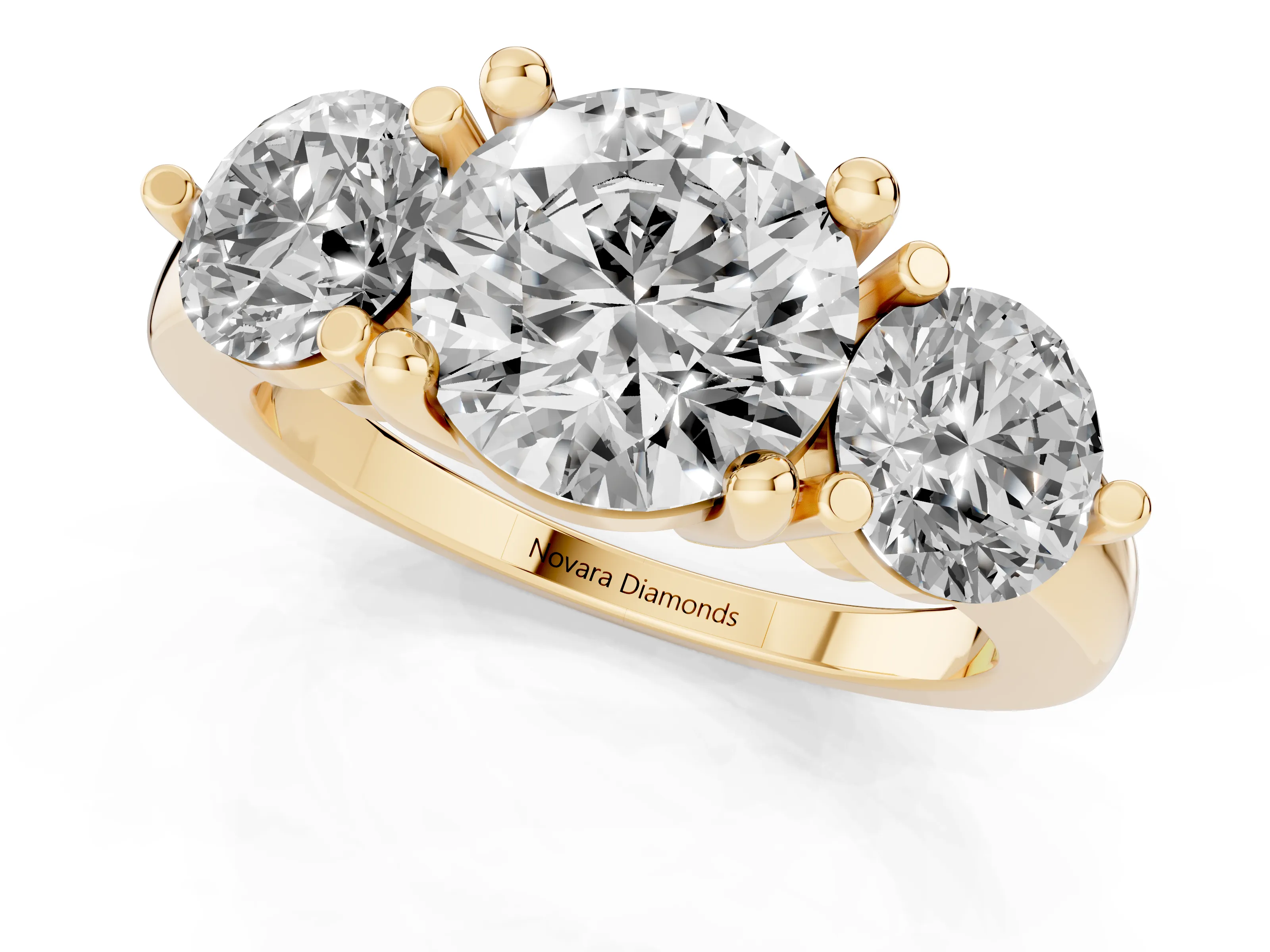 Round Cut Diamond Three-Stone Ring Set in Yellow gold with Prong Setting and Classic Band