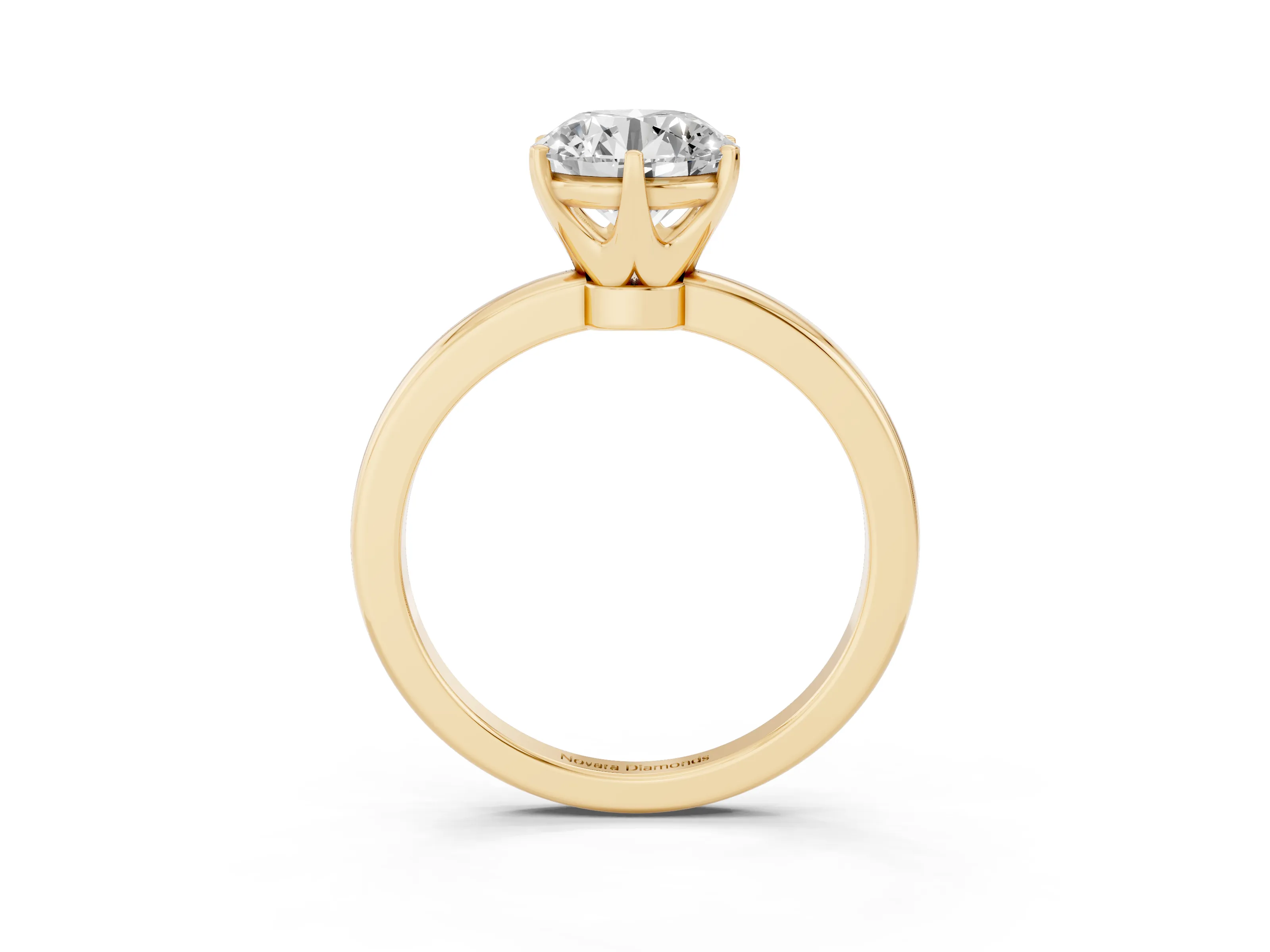 Round Cut Diamond Solitaire Ring Set in Yellow gold with Raised Prong Setting on a Classic Band