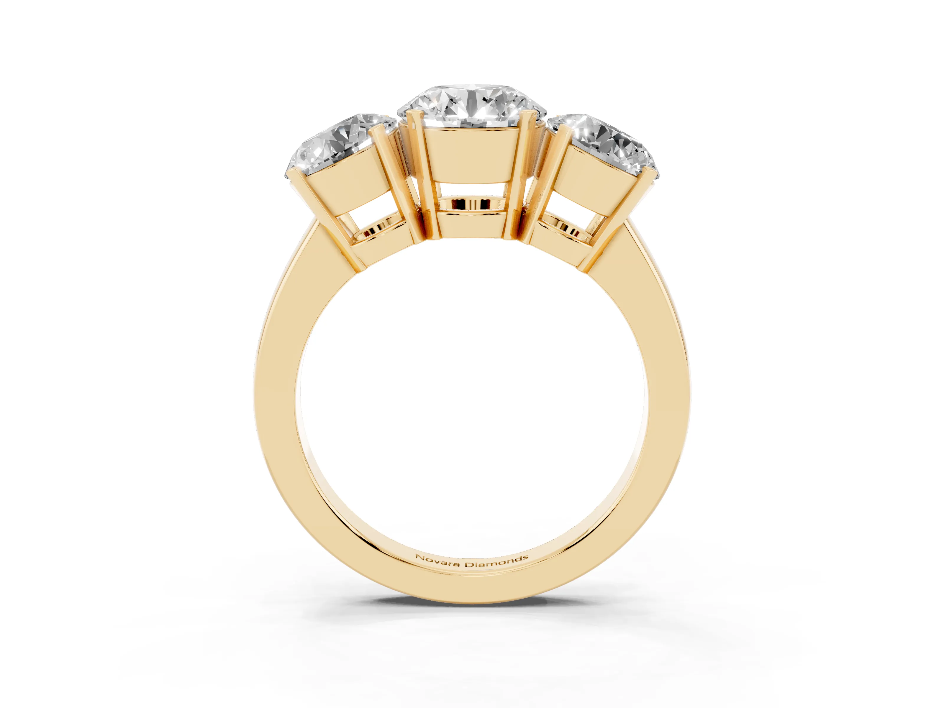 Round Cut Diamond Three-Stone Ring Set in Yellow gold with Channel-Set Band and Prong Settings