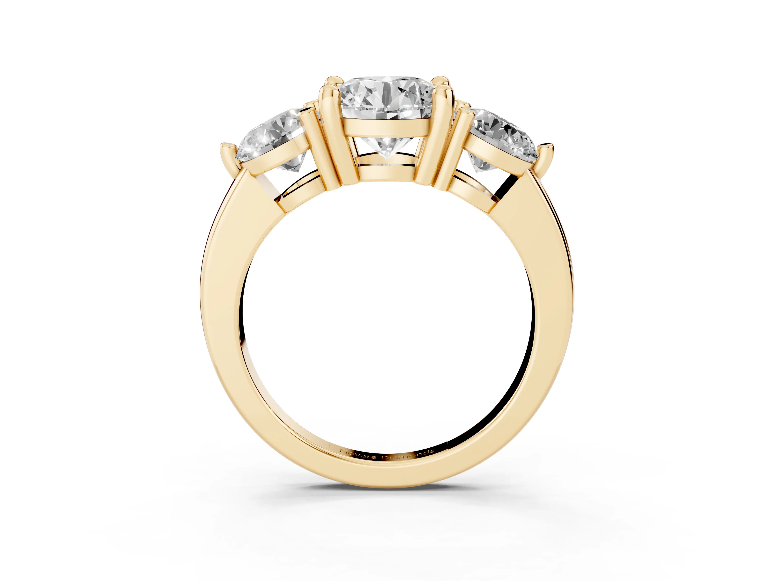 Round Cut Diamond Three-Stone Ring Set in Yellow gold with Prong Setting and Classic Band