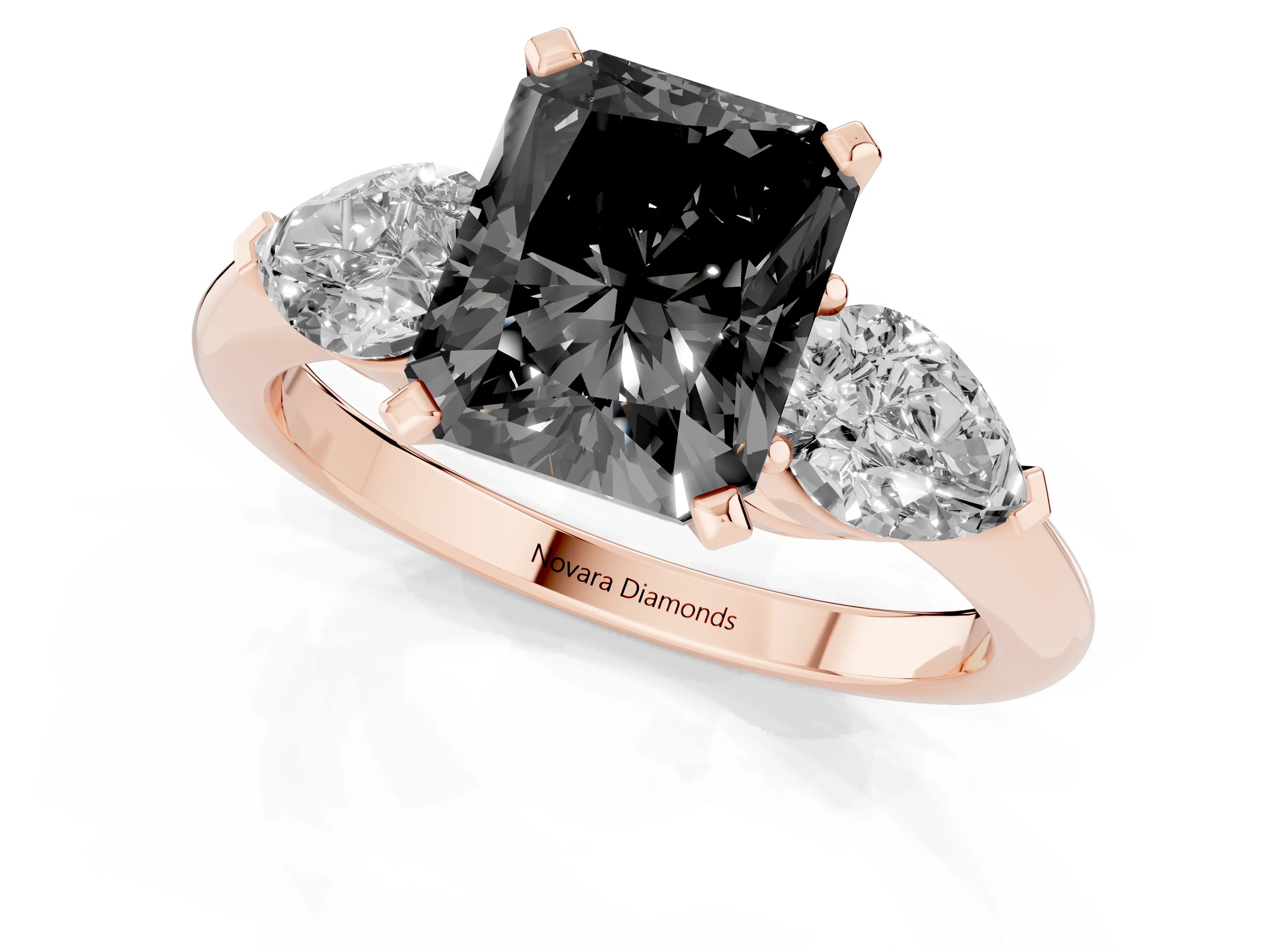 Fancy Black Three-Stone Radiant Cut Diamond Ring Set in Rose gold with Pear Side Stones and Prong Setting
