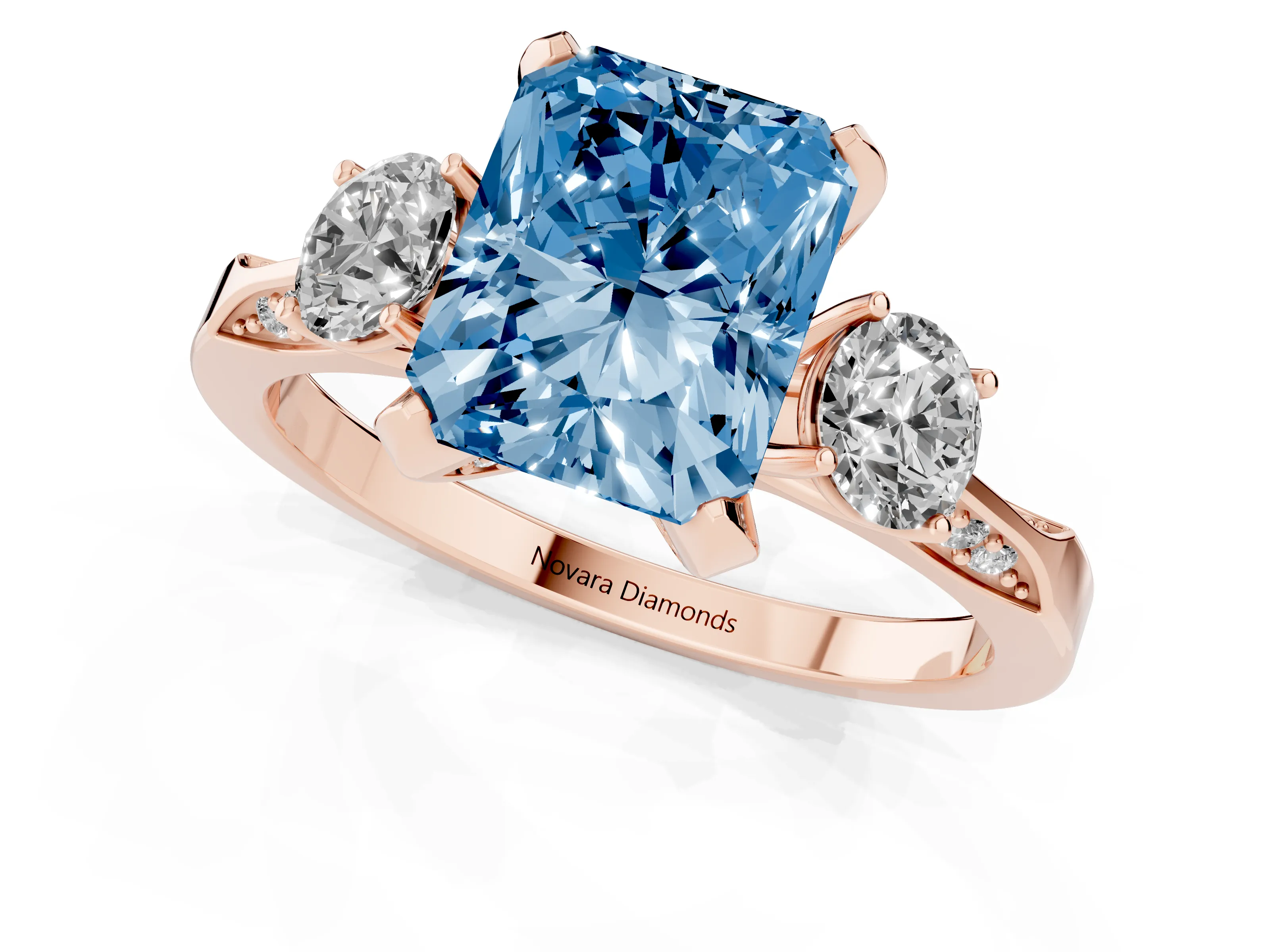 Fancy Blue Radiant Cut Diamond Three-Stone Ring Set in Rose gold with Pavé Band and Smaller Side Stones