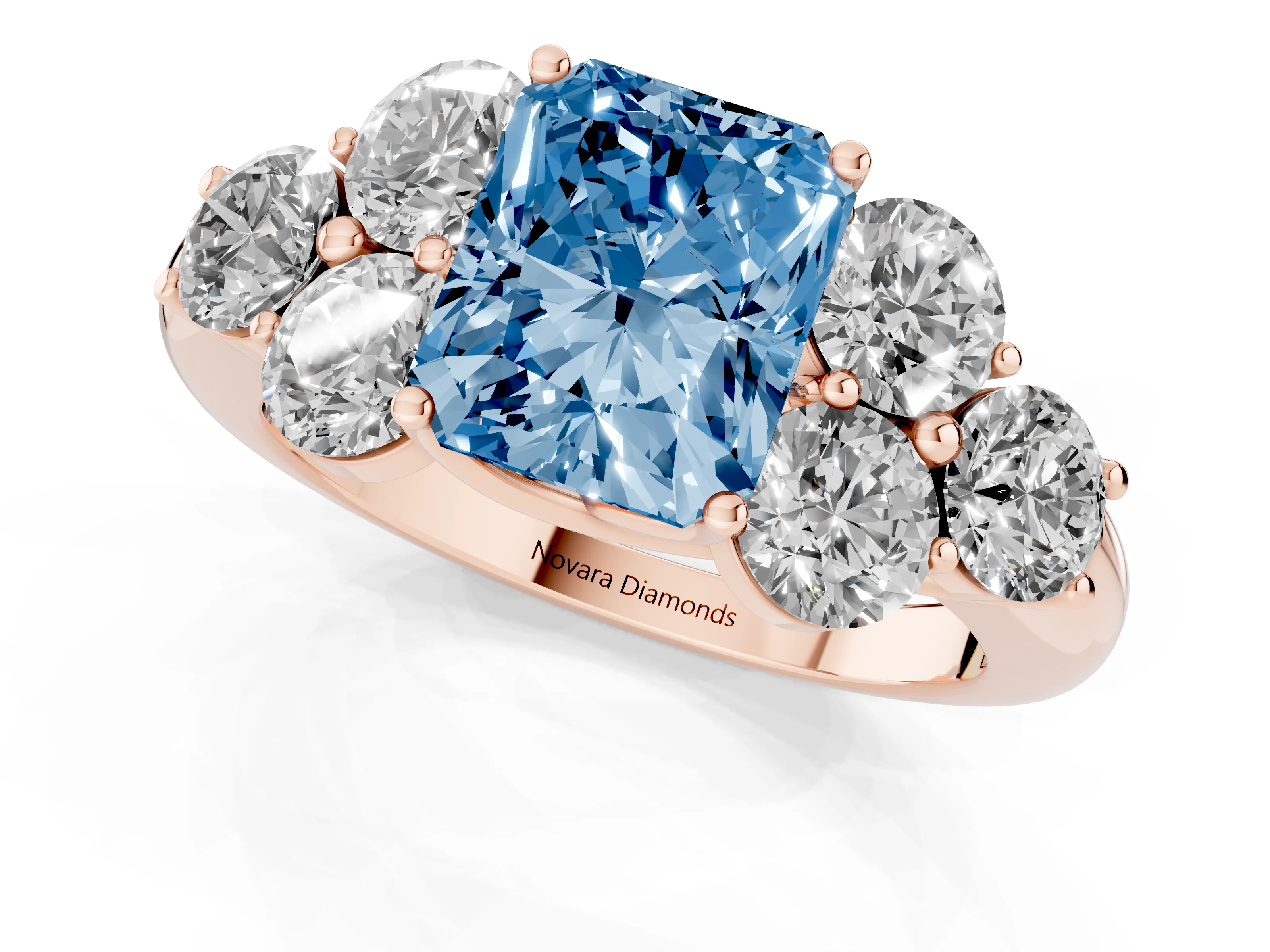 Fancy Blue Radiant Cut Diamond Cluster Ring Set in Rose gold with Round Accent Stones and Prong Setting on a Plain Band