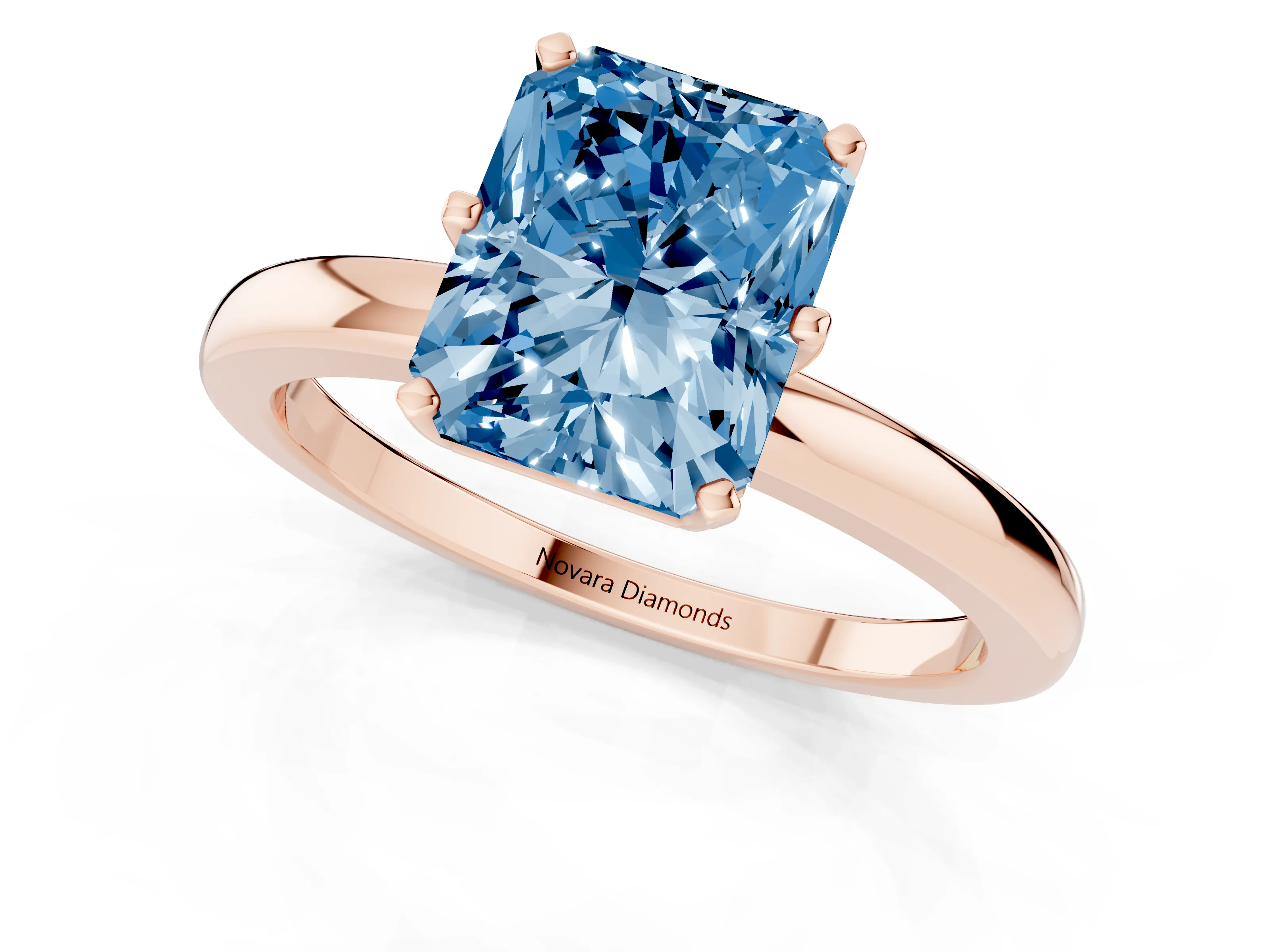 Fancy Blue Radiant Cut Diamond Solitaire Ring Set in Rose gold with Raised Prong Setting on a Classic Band
