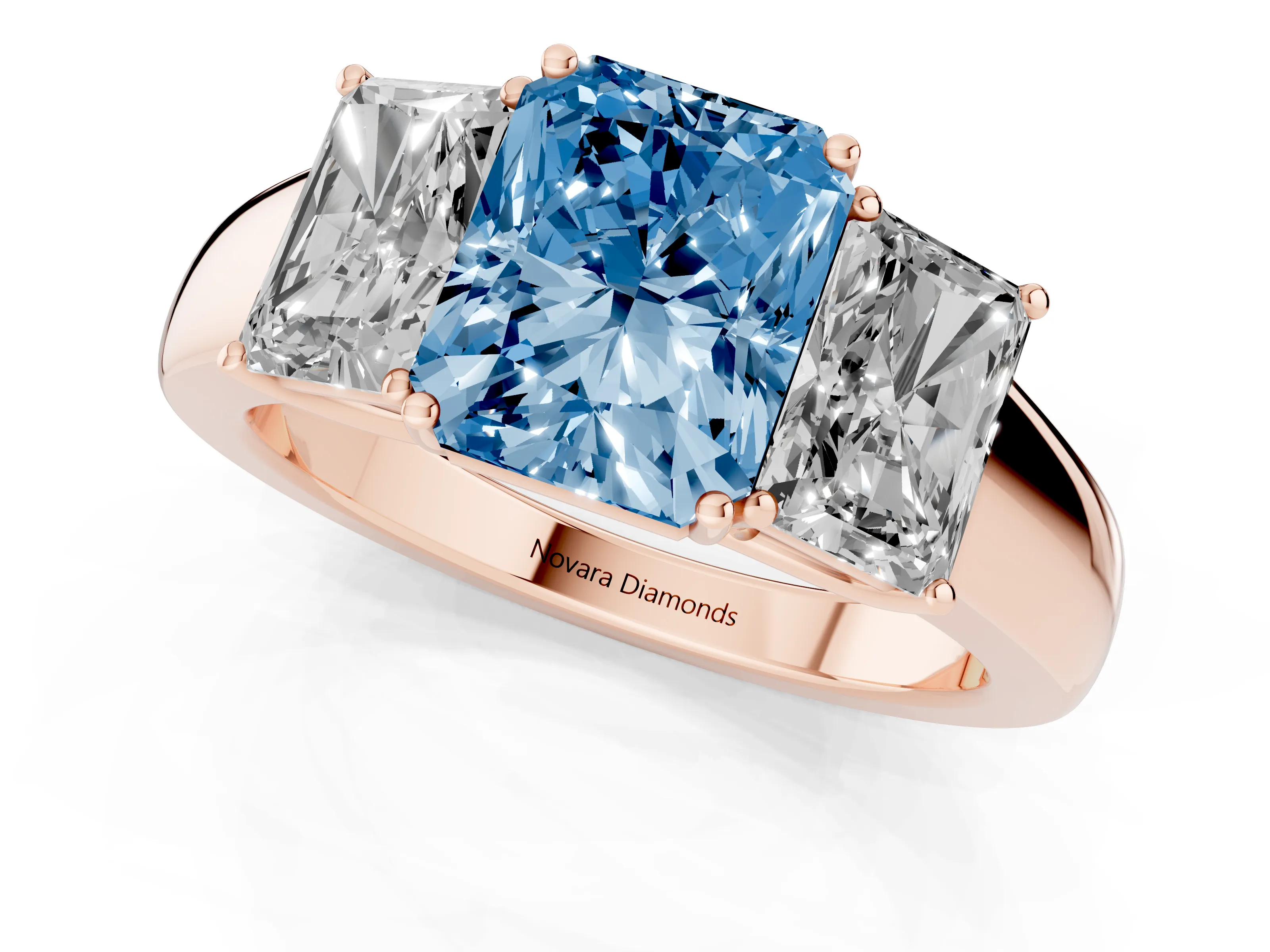 Fancy Blue Three-Stone Radiant Cut Diamond Ring Set in Rose gold with Matching Prong Settings and Plain Band