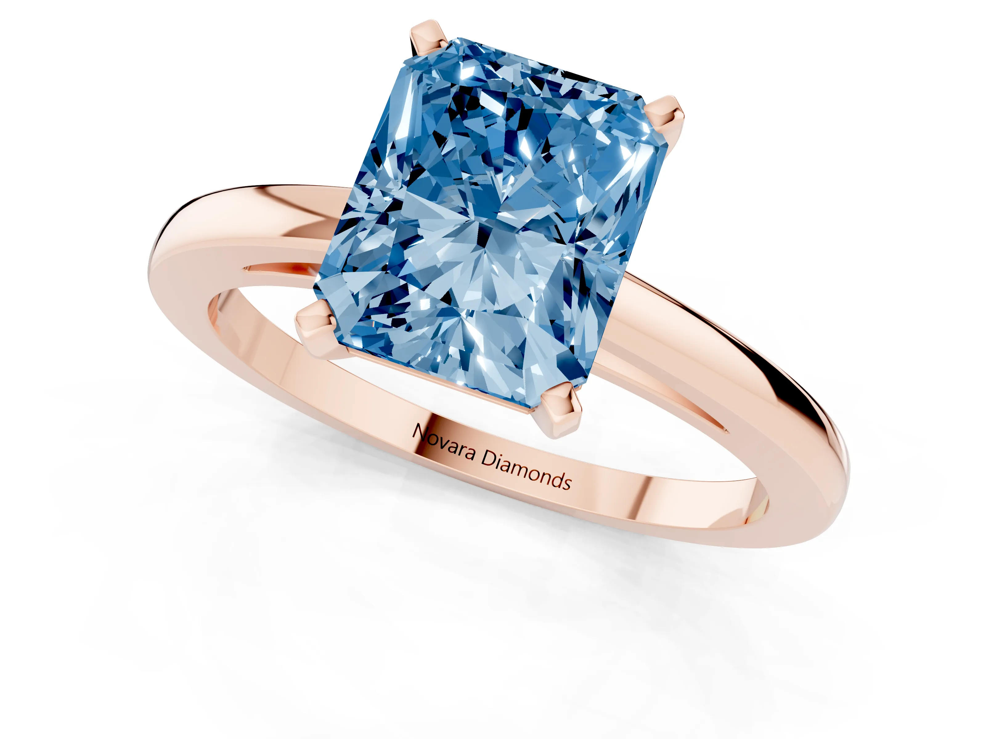 Fancy Blue Radiant Cut Diamond Solitaire Engagement Ring Set in Rose gold with Prong Setting on a Classic Band