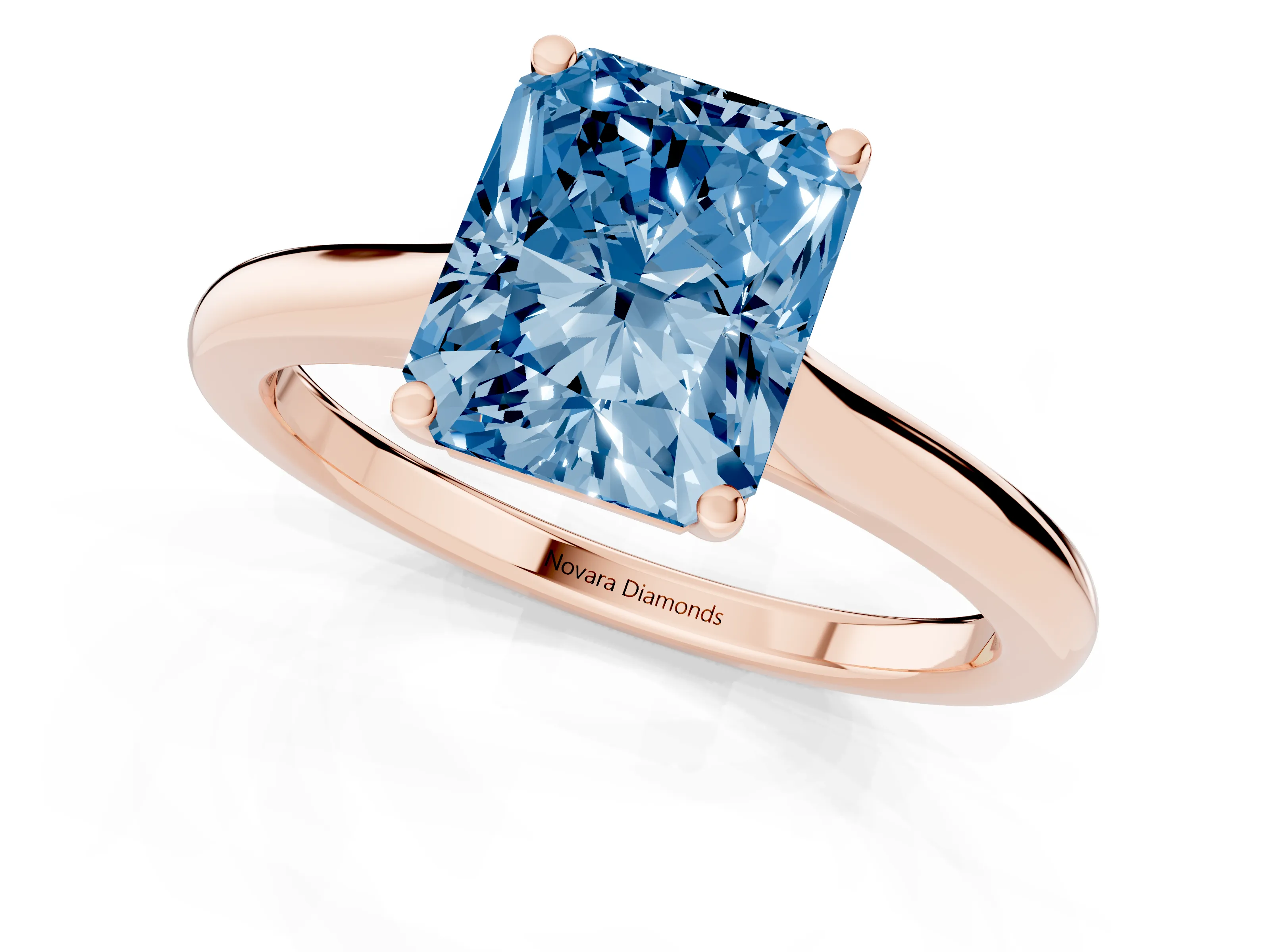 Fancy Blue Radiant Cut Diamond Solitaire Ring Set in Rose gold with Cathedral Band and Prong Setting