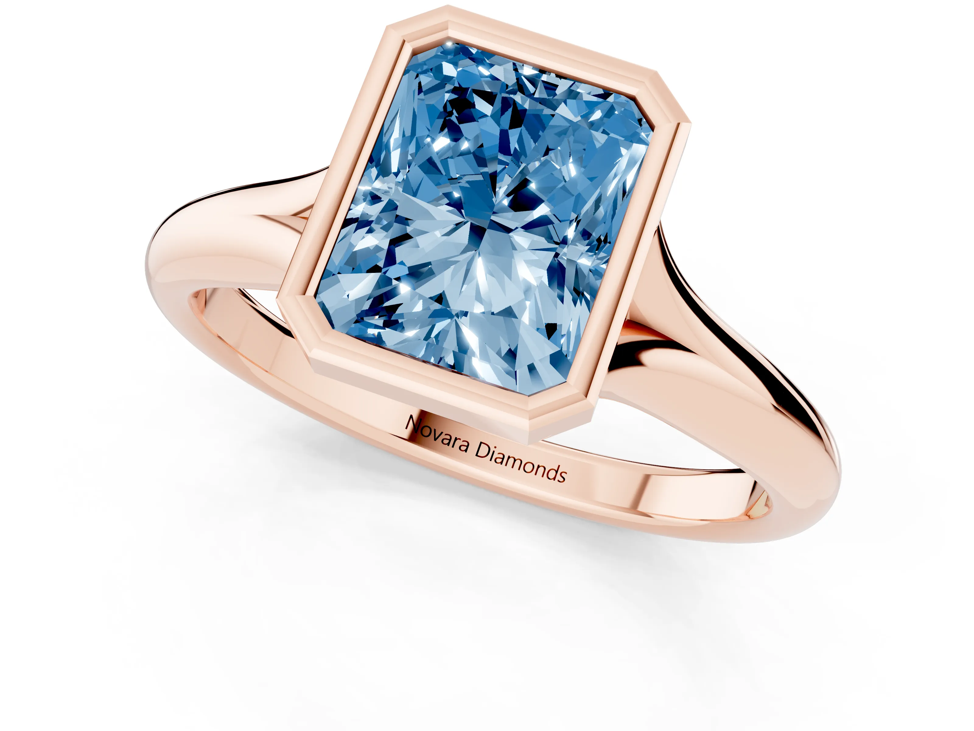 Fancy Blue Bezel Set Radiant Cut Diamond Solitaire Ring Set in Rose gold with Smooth Band