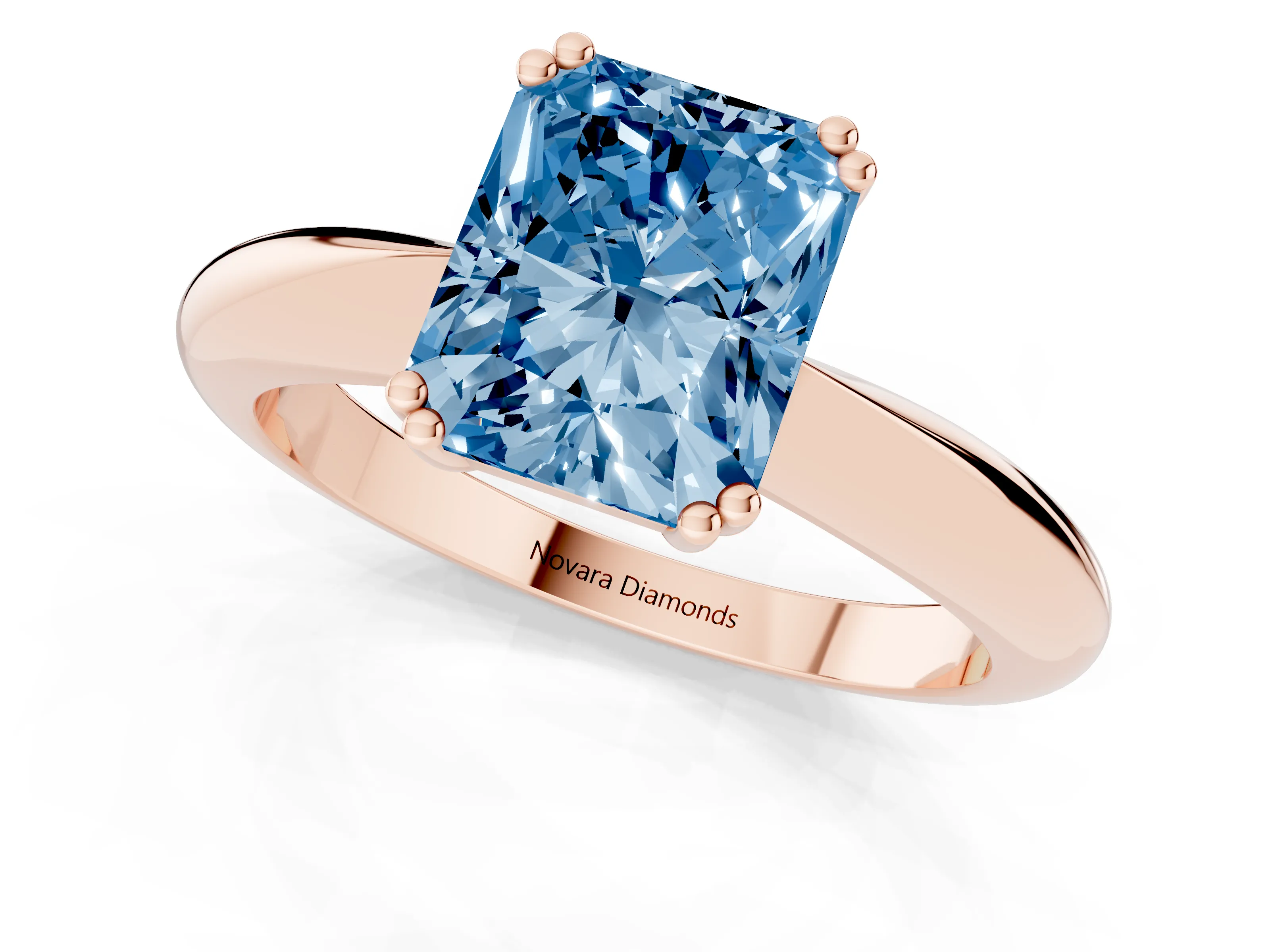 Fancy Blue Radiant Cut Diamond Solitaire Engagement Ring Set in Rose gold with Tapered Band and Prong Setting
