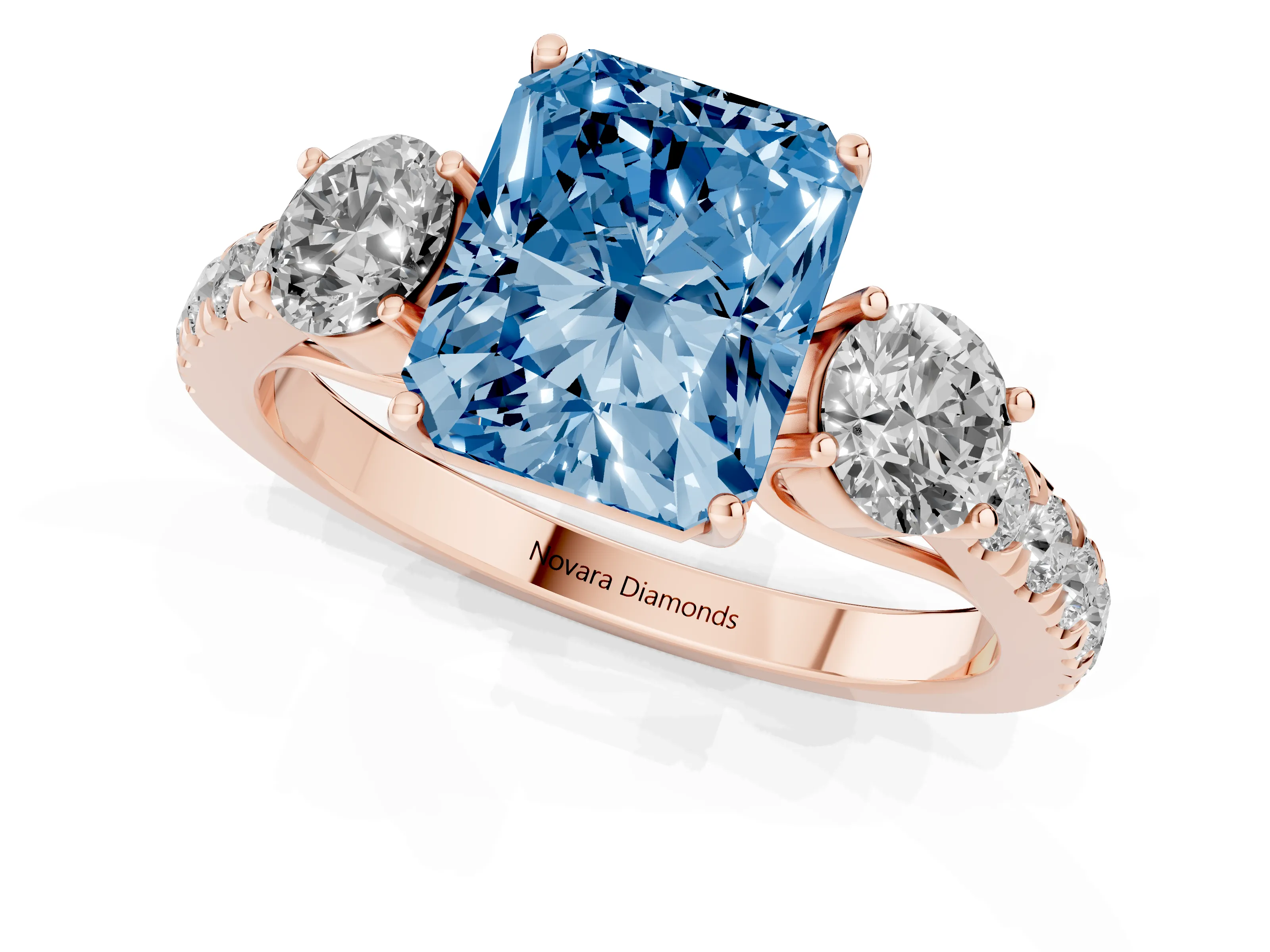Fancy Blue Radiant Cut Diamond Three-Stone Ring Set in Rose gold with Round Side Stones and Delicate Pavé Band