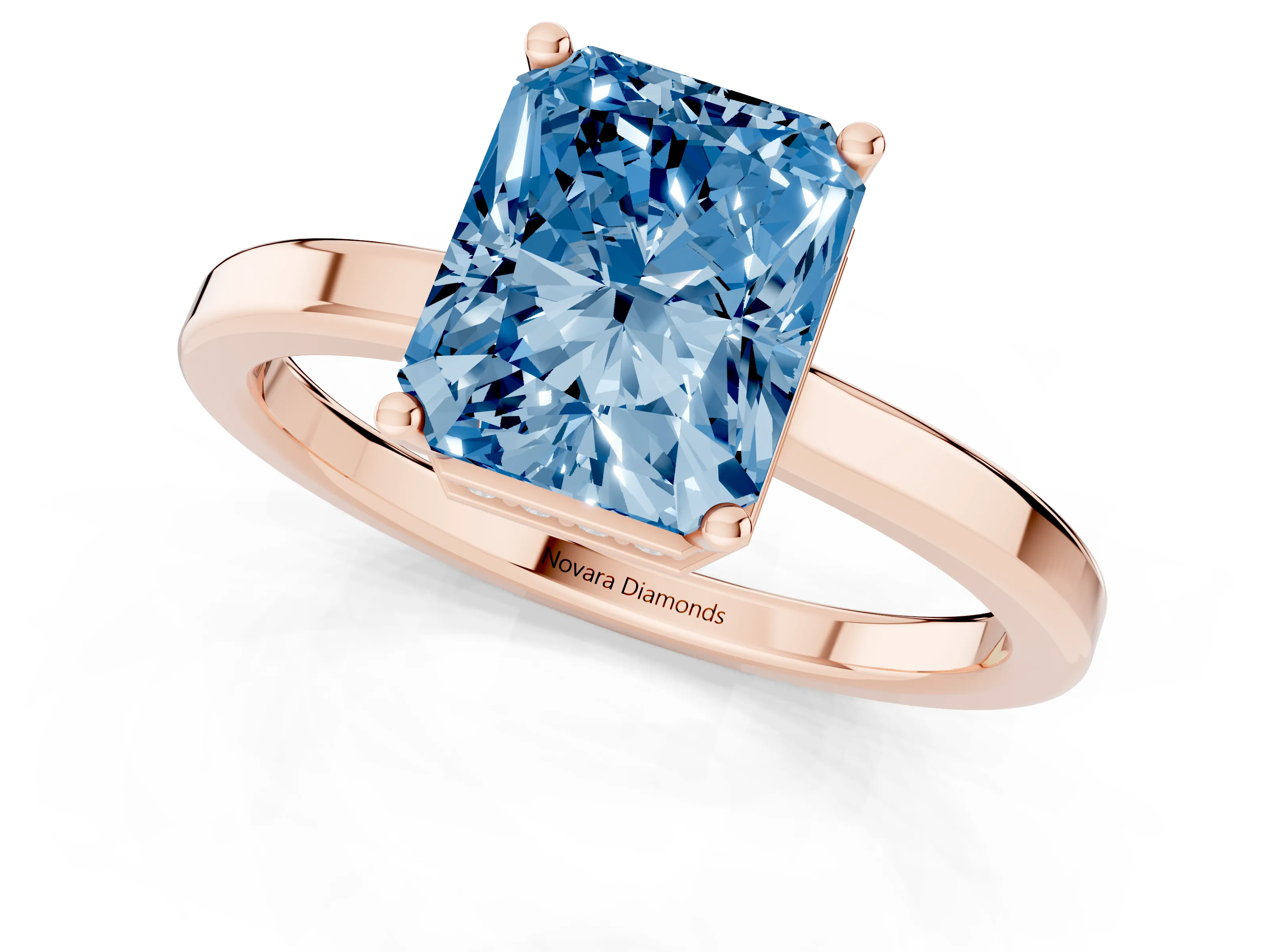 Fancy Blue Radiant Cut Diamond Solitaire Engagement Ring Set in Rose gold with Prong Setting on a Plain Band