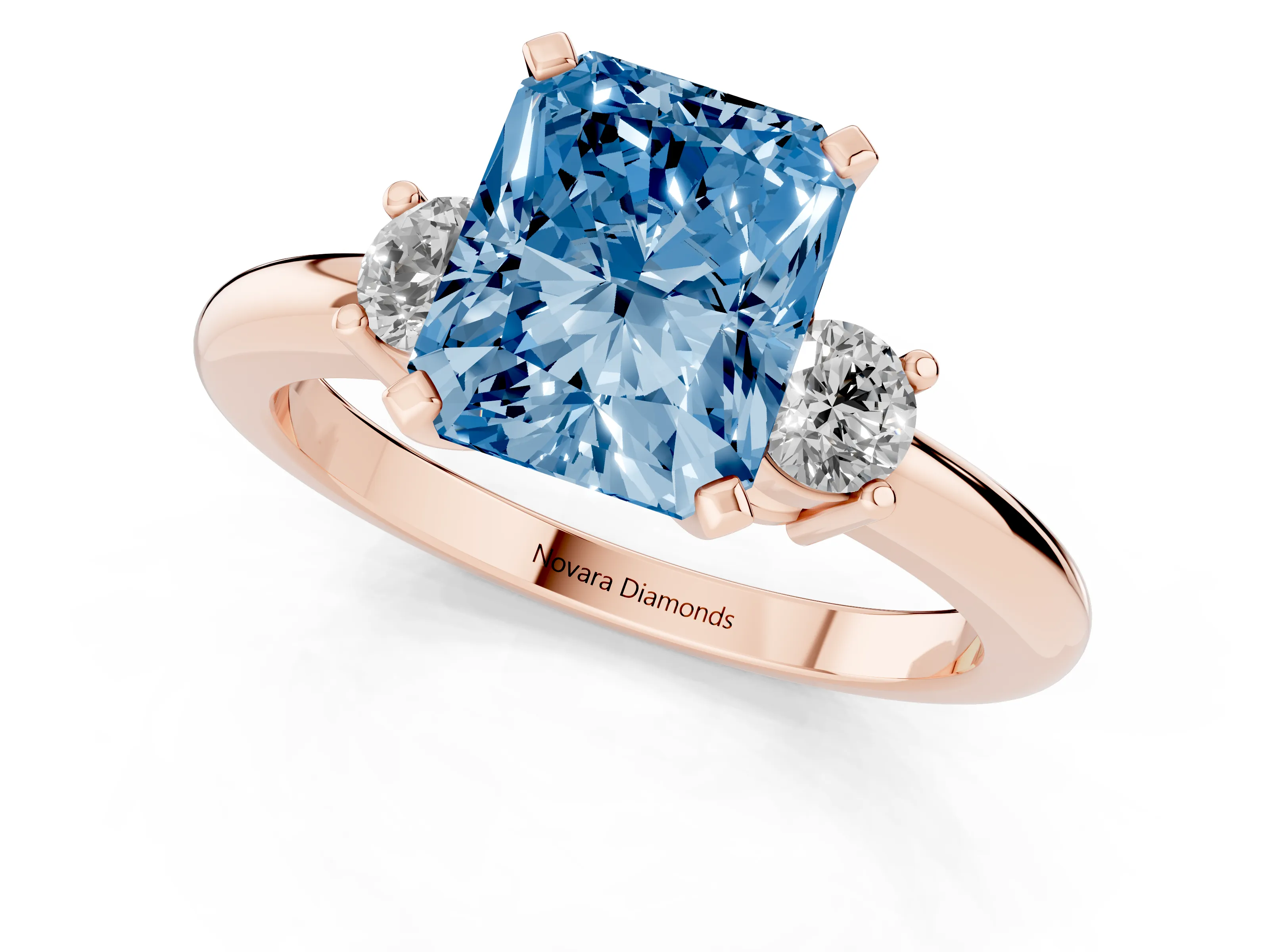 Fancy Blue Three-Stone Radiant Cut Diamond Ring Set in Rose gold with Prong Setting and Plain Band